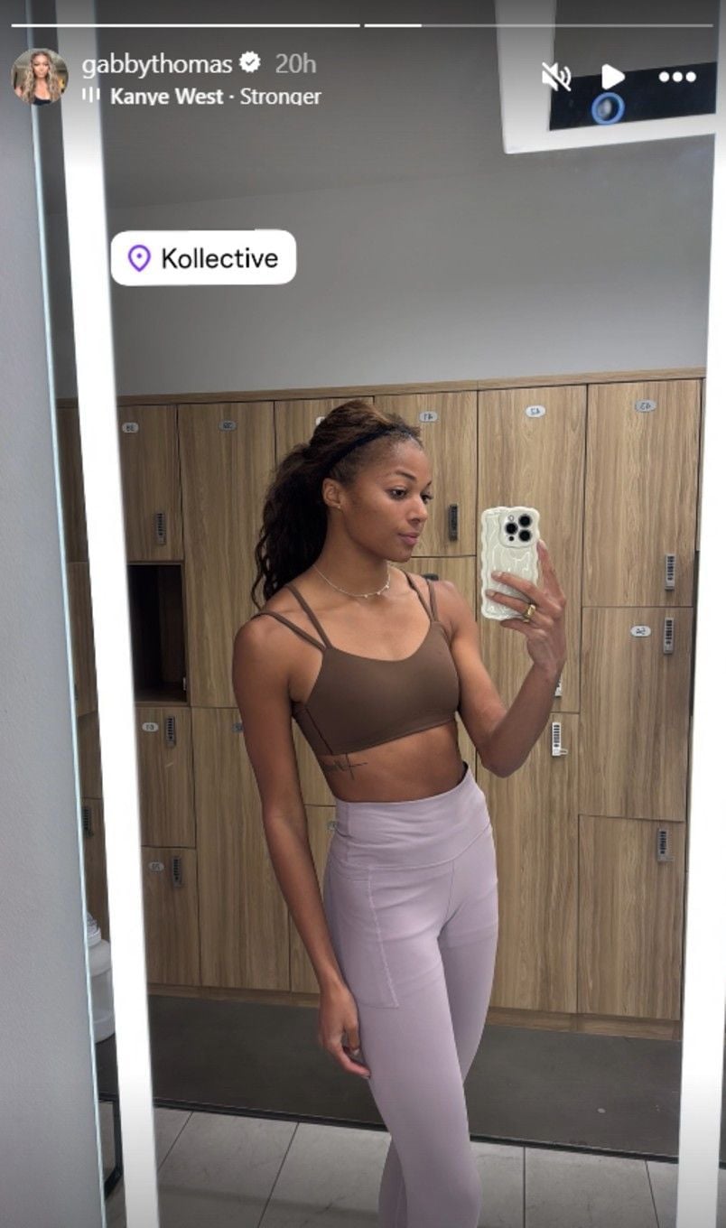 Gaby Rocks Gabby Thomas rocks brown performance crop top and grey full-length ...