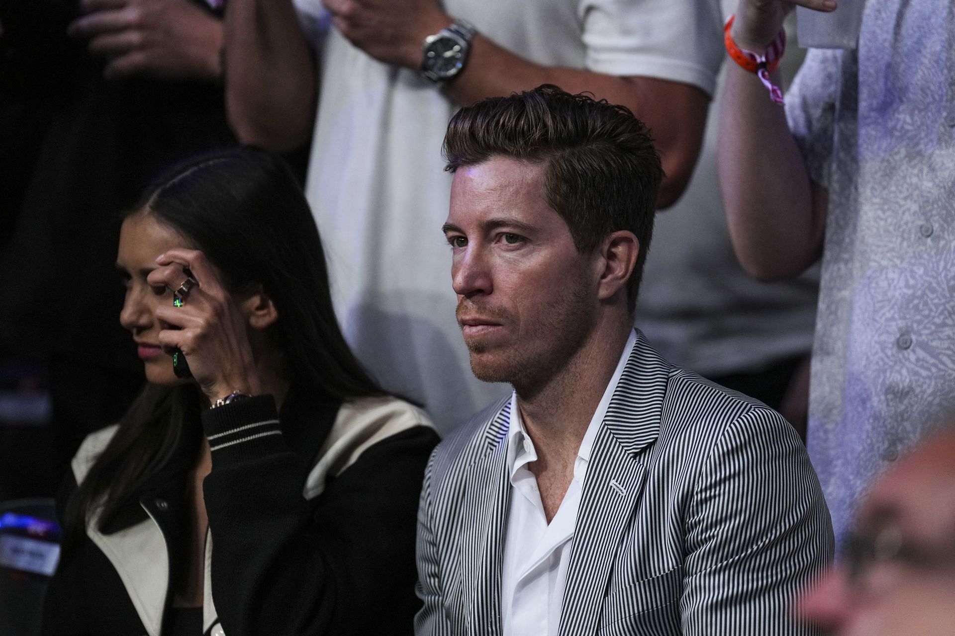 White attending a UFC event at the T-Mobile Arena wearing a grey blazer (Image via: Getty Images)