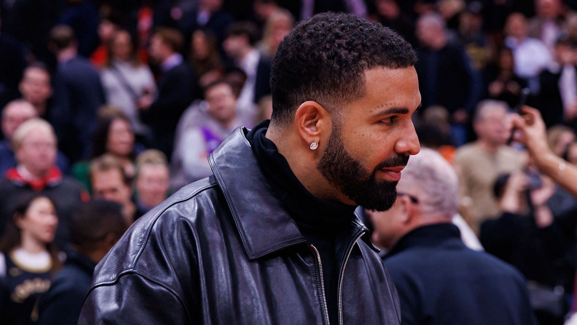 Rapper Drake leaves the court following the NBA game between the Toronto Raptors and the Golden State Warriors at Scotiabank Arena on January 13, 2025, in Toronto, Canada. (Image via Getty/Cole Burston)