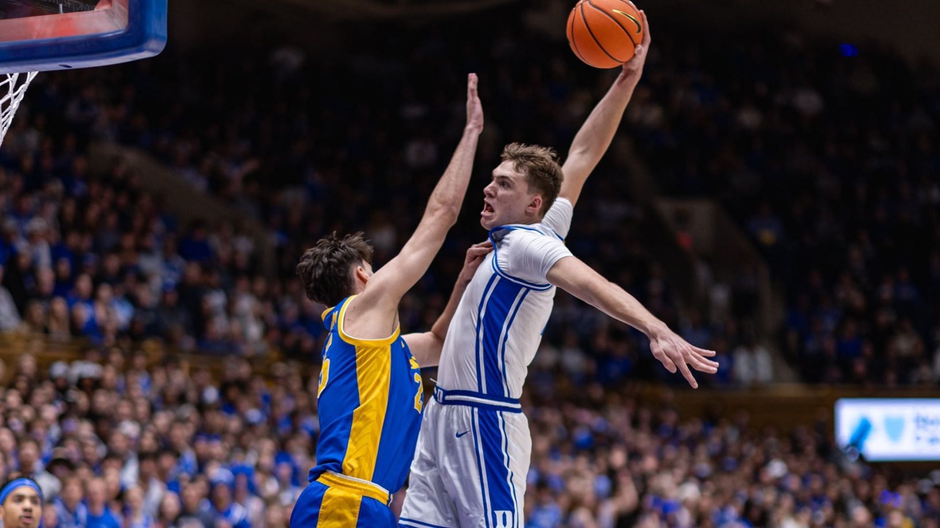 Cooper Flagg dunking over Guillermo Diaz Graham. - Source: @DukeMBB on X