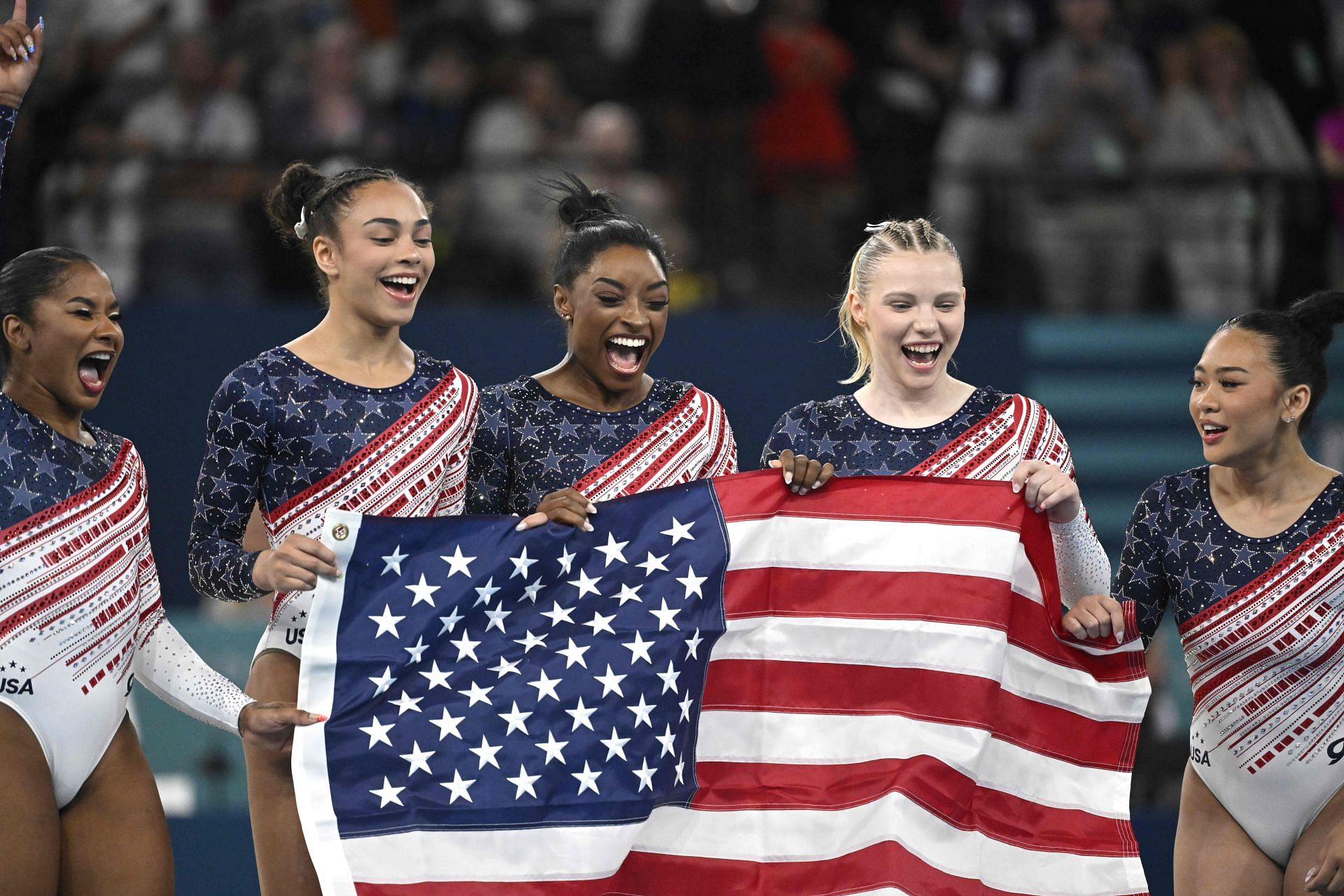 USA Women&#039;s Gymnastics team celebrating gold at Paris Olympics (Image Source: Getty)