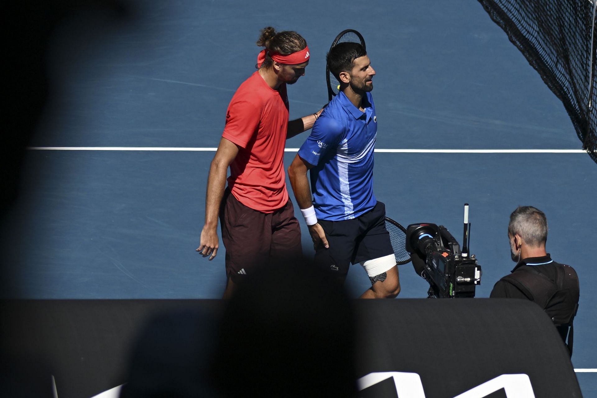 Alexander Zverev comforts Novak Djokovic following Serb&#039;s retirement in Melbourne (Source: Getty)