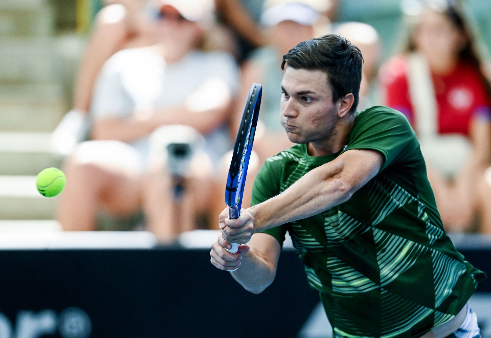 Miomir Kecmanovic hits a backhand in Adelaide