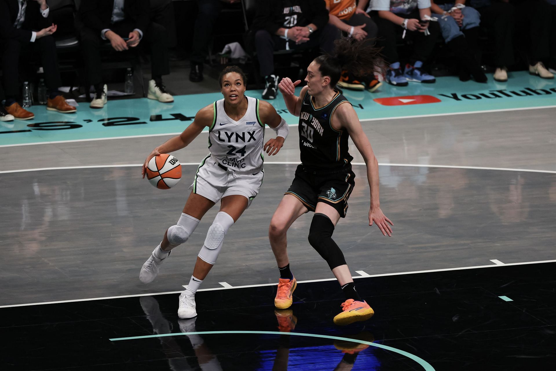 NEW YORK, NEW YORK - OCTOBER 20: Napheesa Collier #24 of the Minnesota Lynx drives to the basket against Breanna Stewart #30 of the New York Liberty - Source: Getty