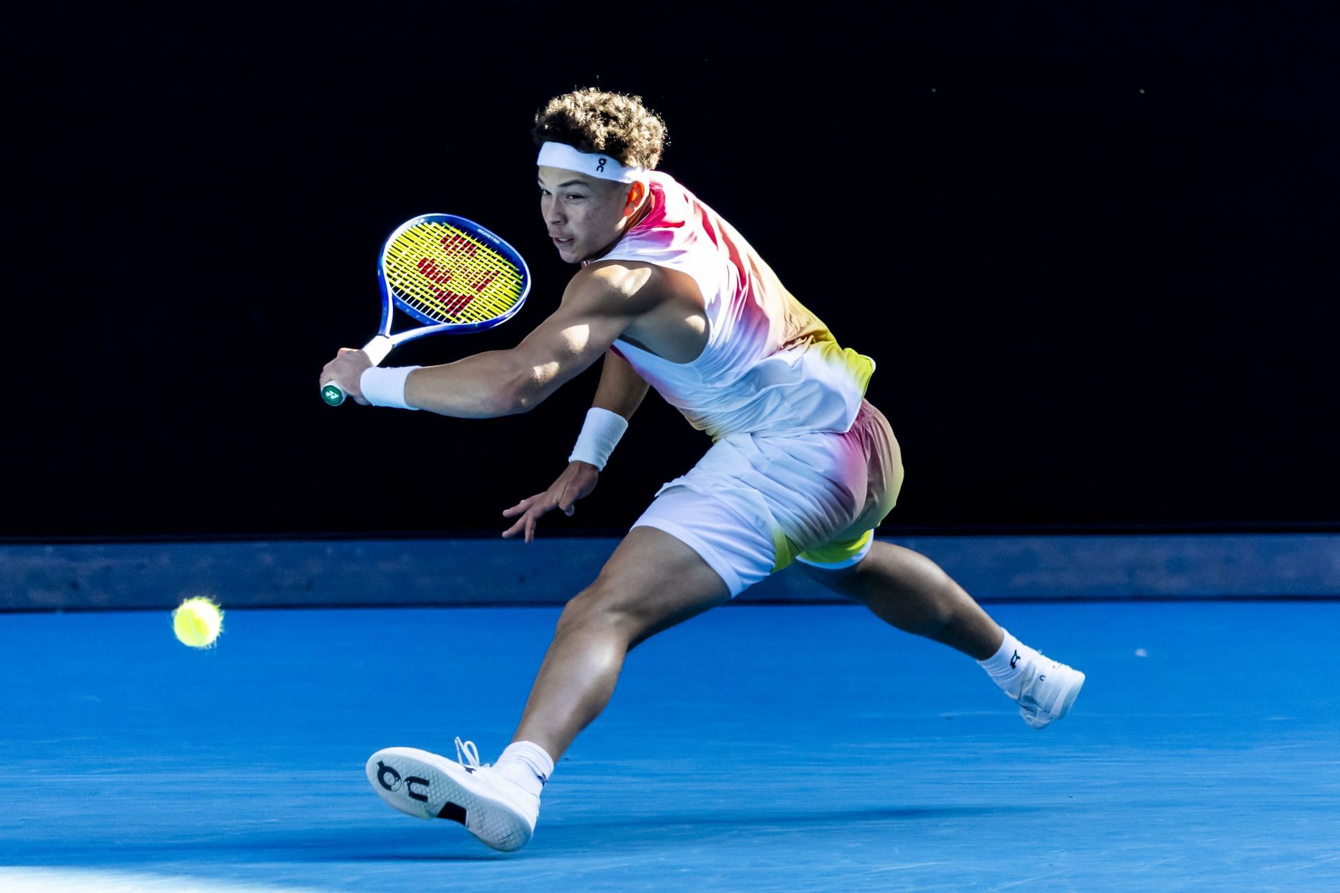 Ben Shelton tracks down a ball during his QF match in Melbourne