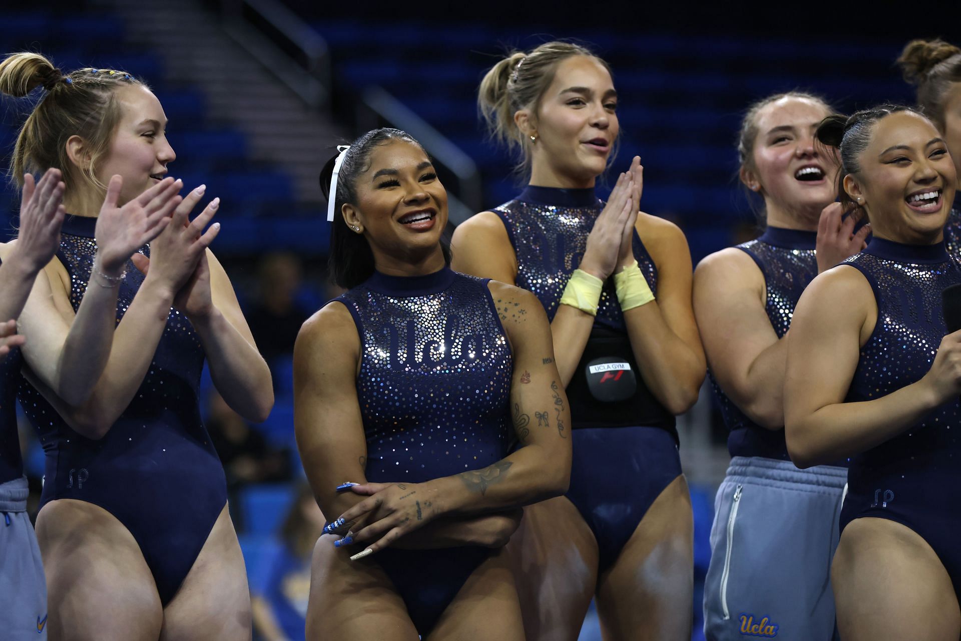 Jordan Chiles and her teammates look on at the UCLA Gymnastics&#039; &quot;Meet The Bruins&quot; - (Source: Getty)