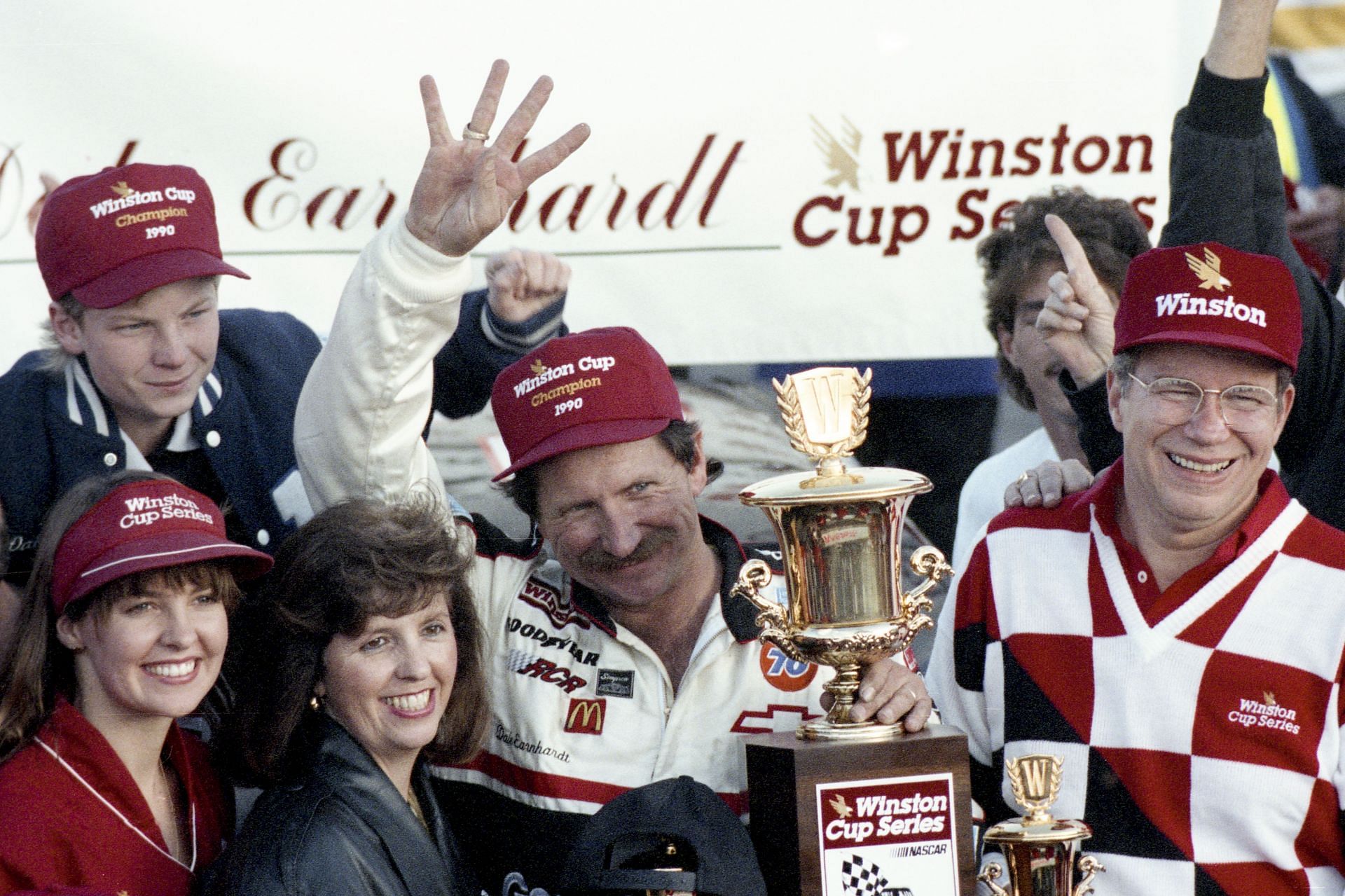 Dale Earnhardt celebrates his 4th NASCAR Winston Cup Championship with son Dale Earnhardt Jr., top left, - Source: Getty