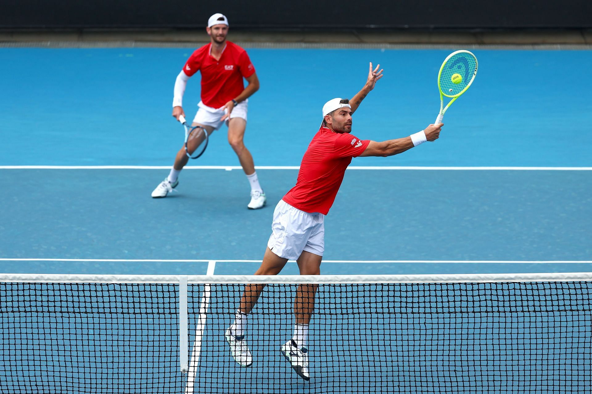 Andrea Vavassori is playing volley and Simone Bolelli is at the baseline - Source: Getty