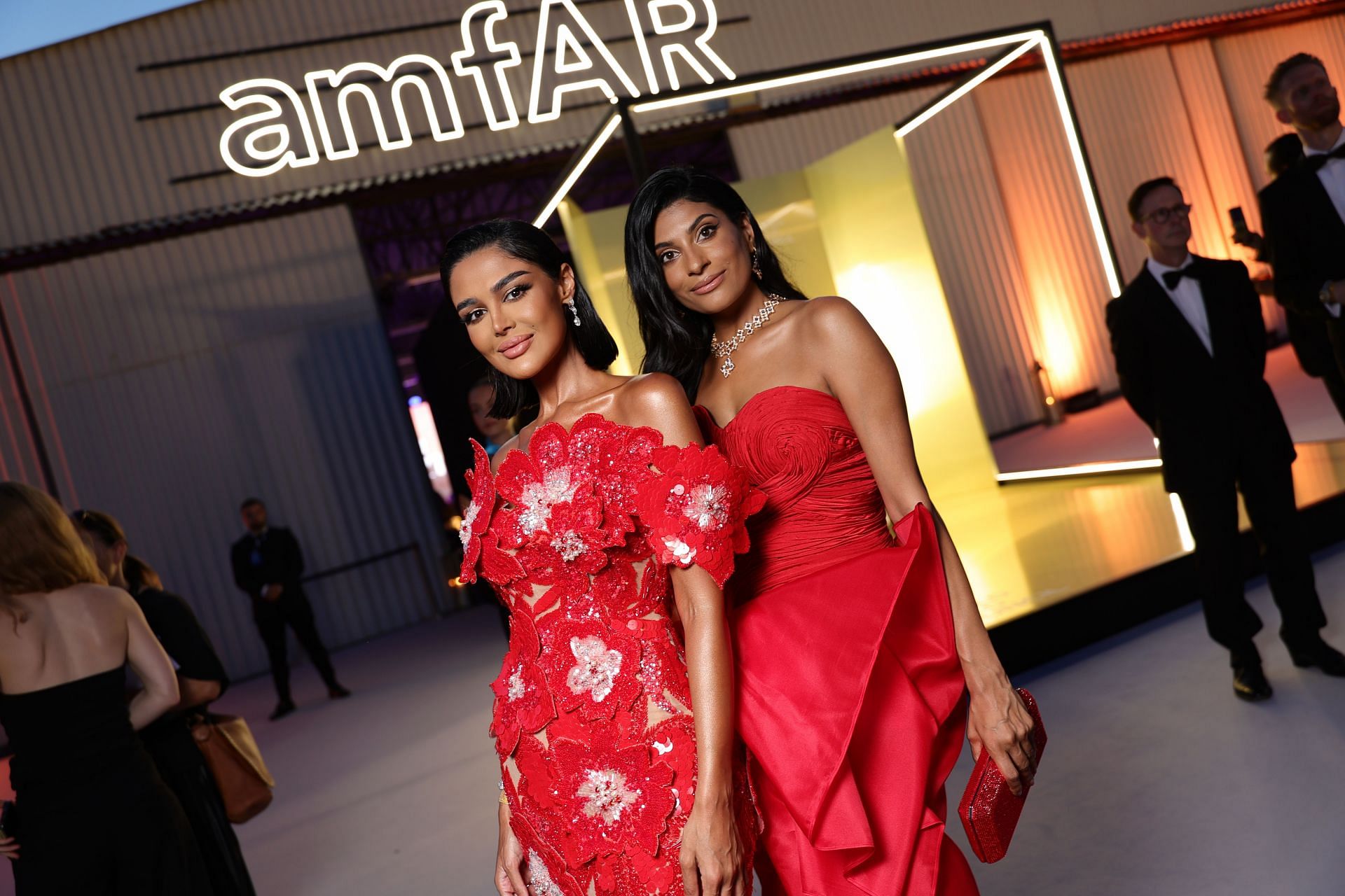 Farhana Bodi (R) and a guest attend the amfAR Gala Venezia 2024 (Image via Getty)