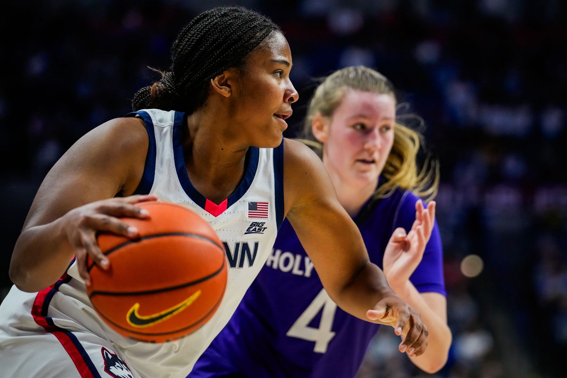 Sarah Strong (#21) of the UConn Huskies is defended by Meg Cahalan (#4) of the Holy Cross Crusaders during the first half of their NCAA women&#039;s basketball game at the Harry A. Gampel Pavilion on Dec. 3, 2024 in Storrs, Connecticut. Photo: Getty