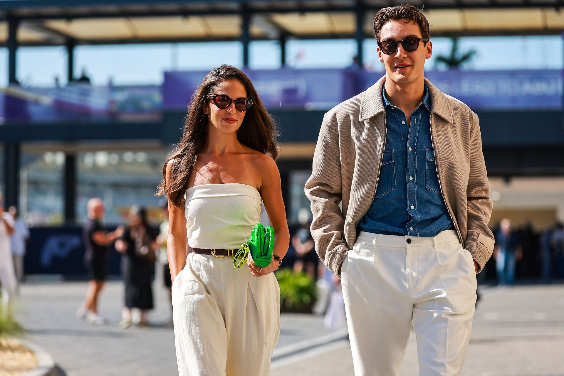 George Russell walks in the paddock with girlfriend, Carmen Mundt, during the F1 Grand Prix of Abu Dhabi at Yas Marina Circuit - Source: Getty