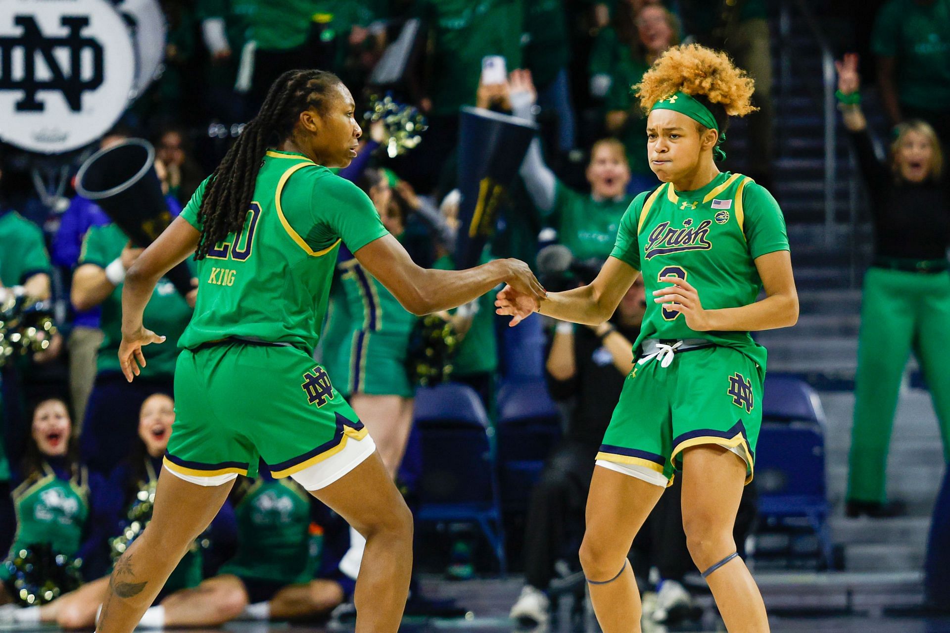 Liatu King (#20) and Hannah Hidalgo (#3) of the Notre Dame Fighting Irish are fired up after a three-point shot was scored during the game against the UConn Huskies at Purcell Pavillion at the Joyce Center on December 12, 2024 in South Bend, Indiana. Photo: Getty