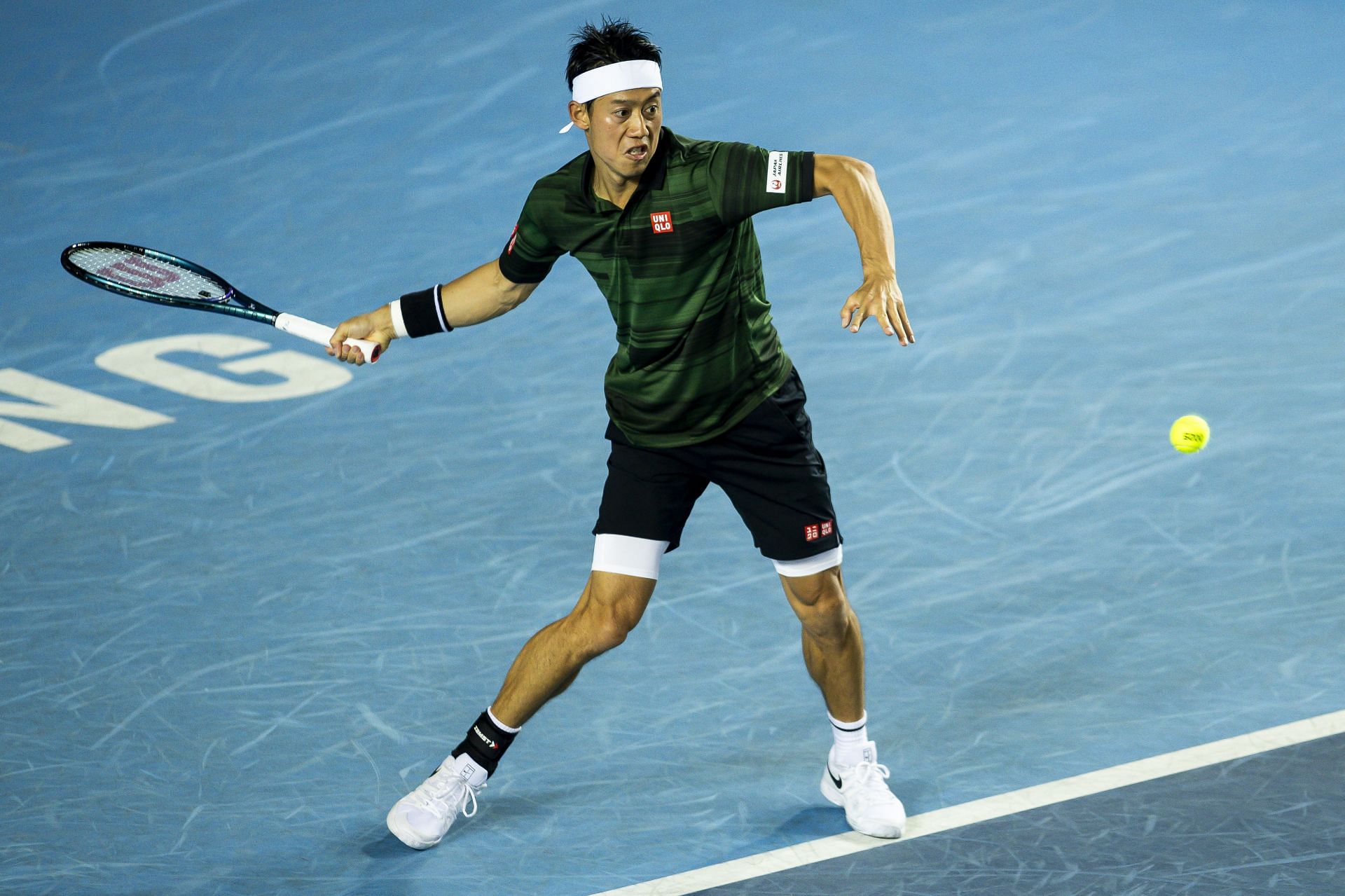 Kei Nishikori hits a forehand in Hong Kong