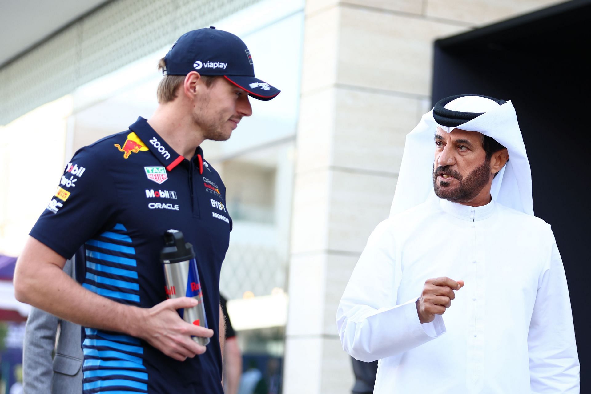 Max Verstappen of the Netherlands and Oracle Red Bull Racing and Mohammed ben Sulayem, FIA President, talk in the Paddock- Source: Getty