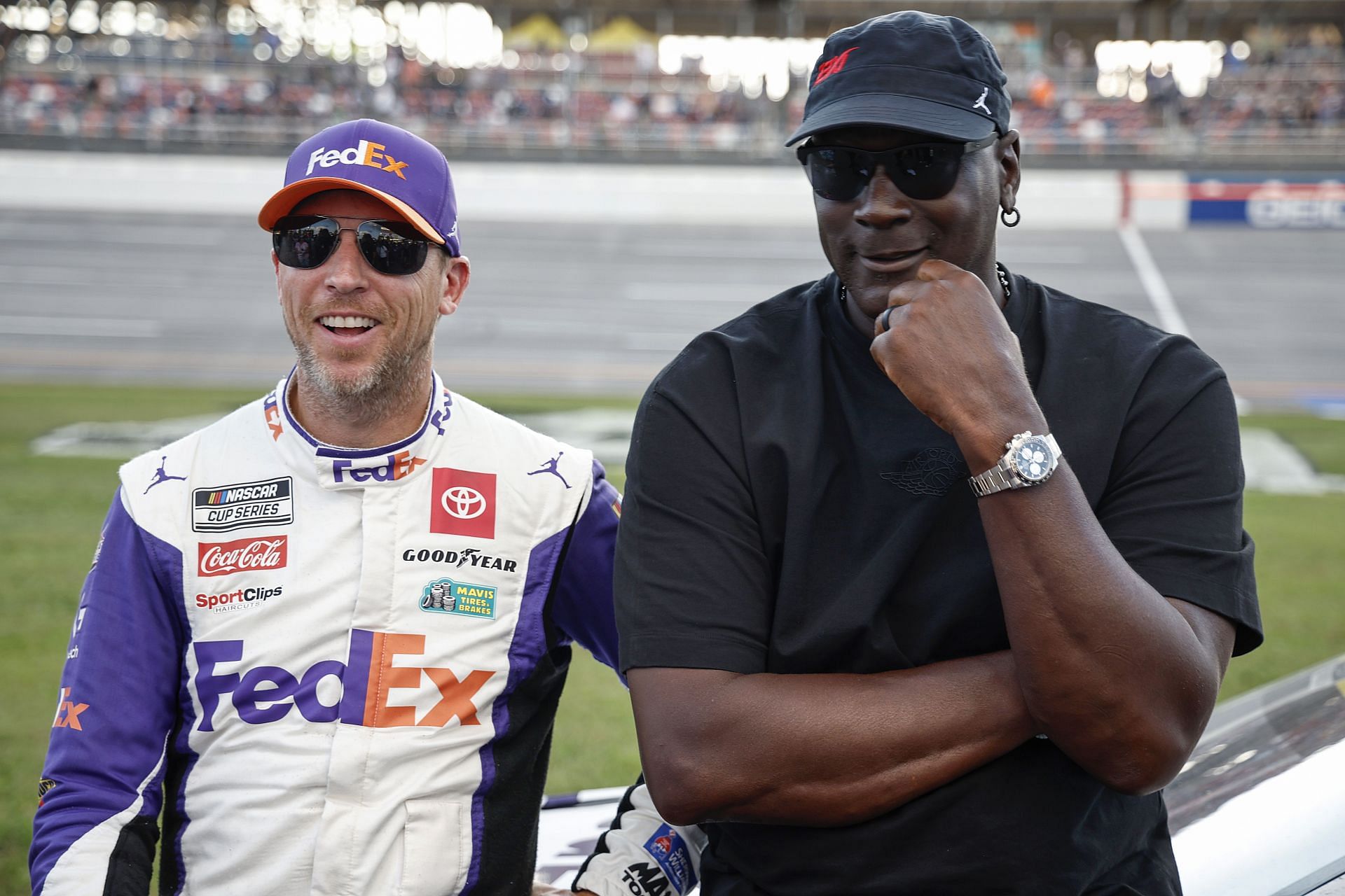 Co-owners of 23XI Racing, Denny Hamlin, driver of the #11 FedEx One Rate Toyota, and NBA Hall of Famer, Michael Jordan - Source: Getty