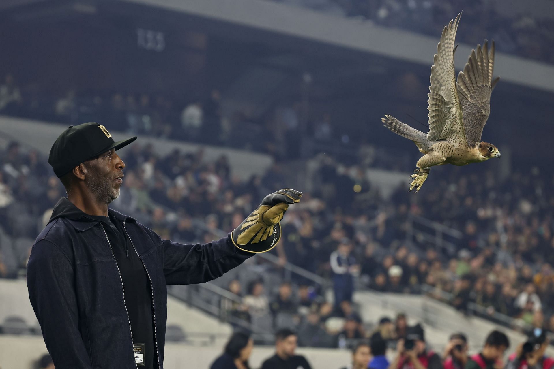 Michael Johnson donning a denim jacket and black cap during the US Open Cup Championships (Image via: Getty Images)