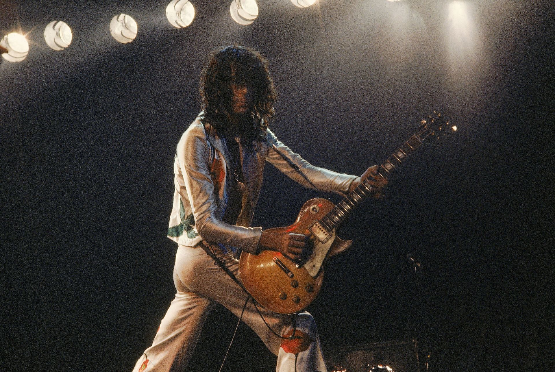 Jimmy Page performing live on stage (Image via Getty)