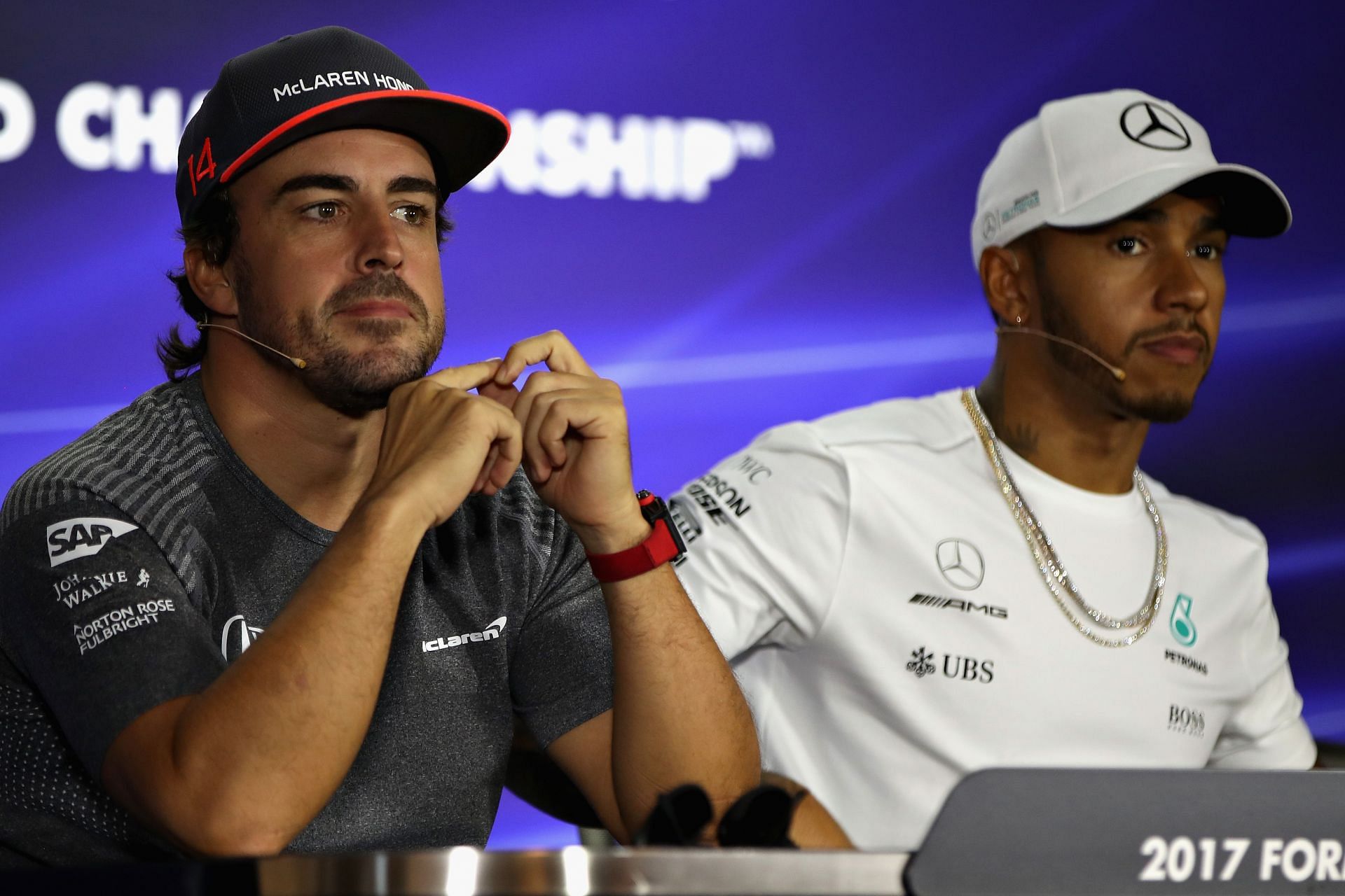 Fernando Alonso and Lewis Hamilton in the Drivers Press Conference during previews ahead of the Formula One Grand Prix of Singapore, 2017 - Source: Getty