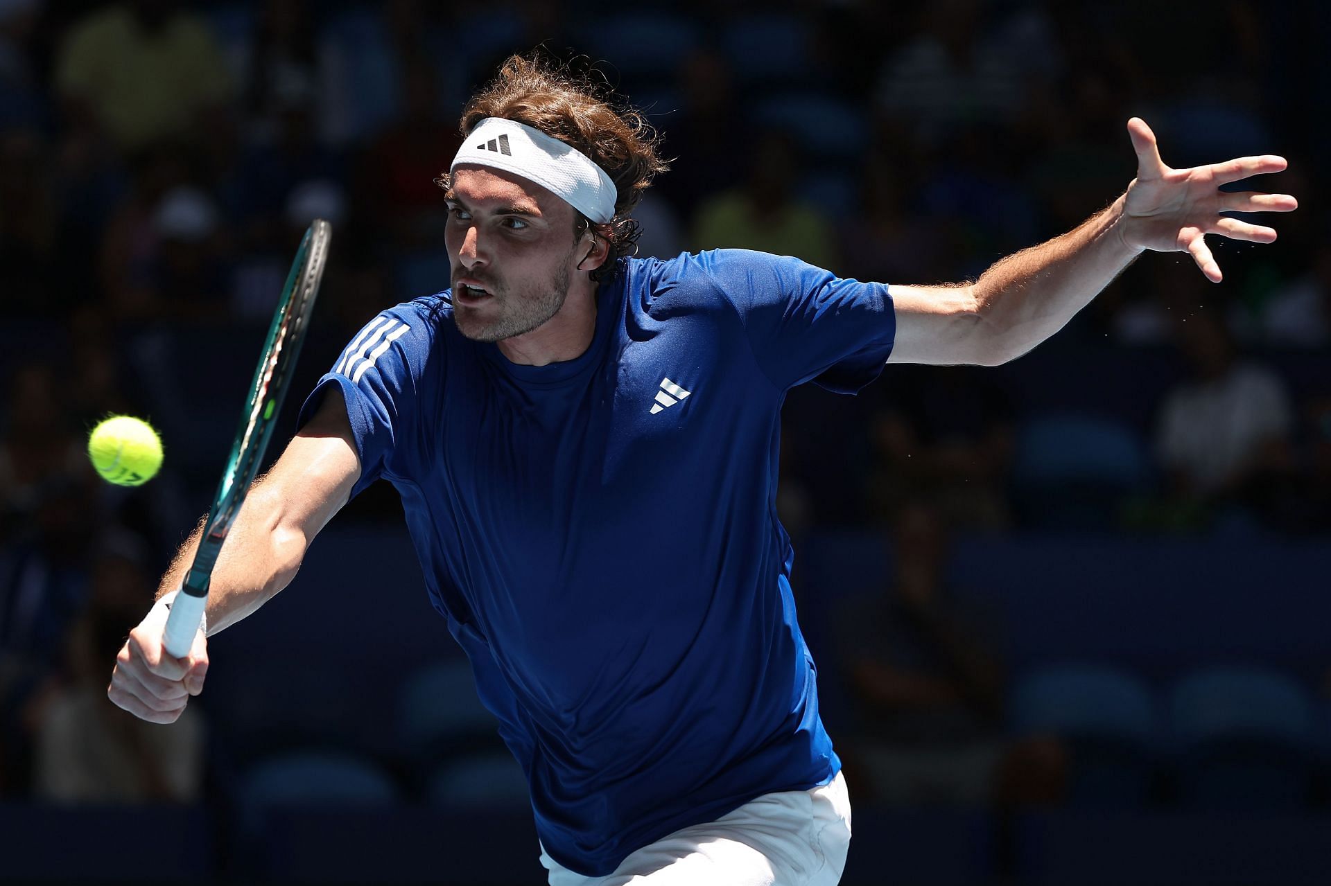 Stefanos Tsitsipas returns a ball at the 2025 United Cup (Image via Getty)