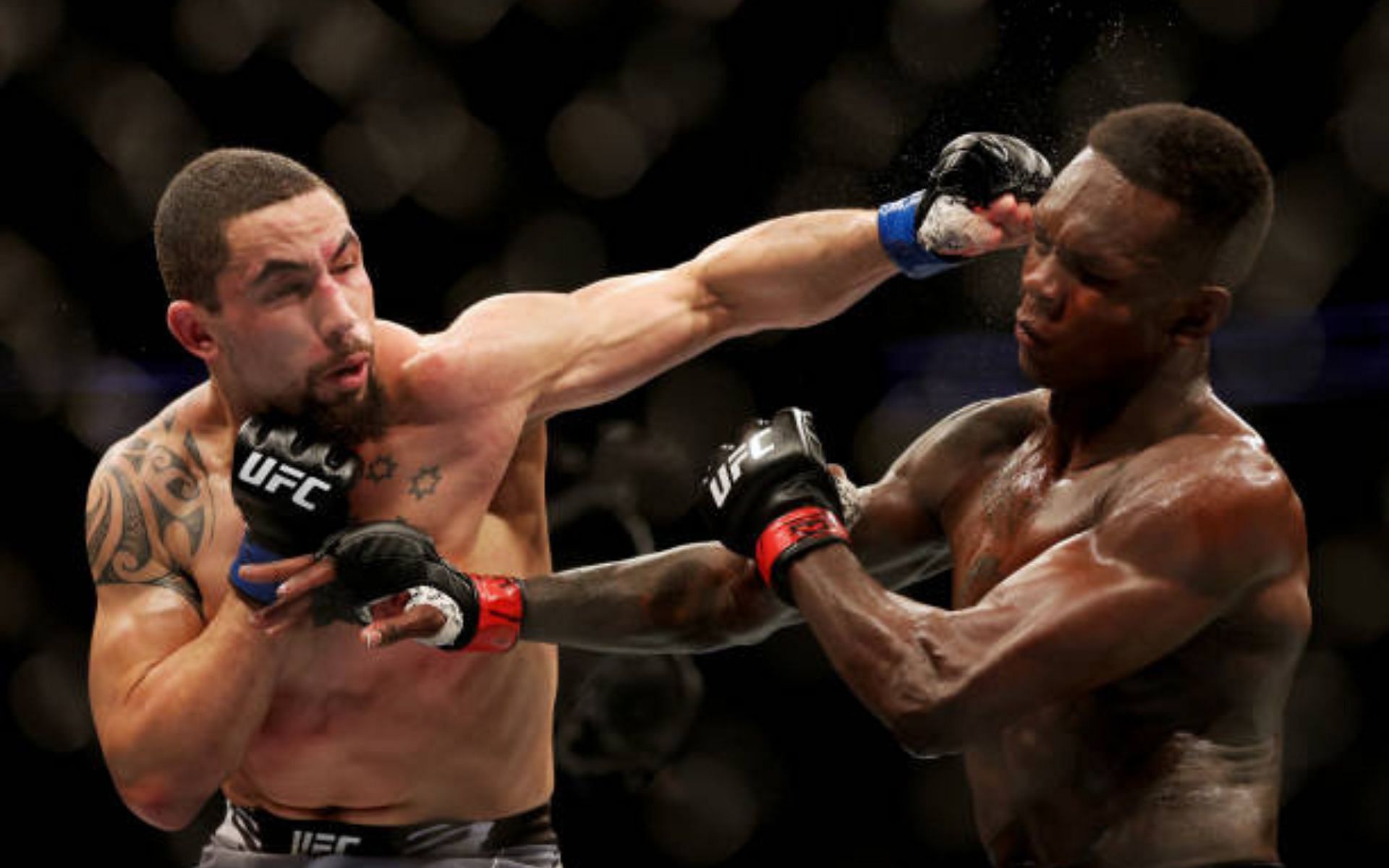 Robert Whittaker (left) is happy training with Isarel Adesanya (right) at City Kickboxing. [Image courtesy: Getty]