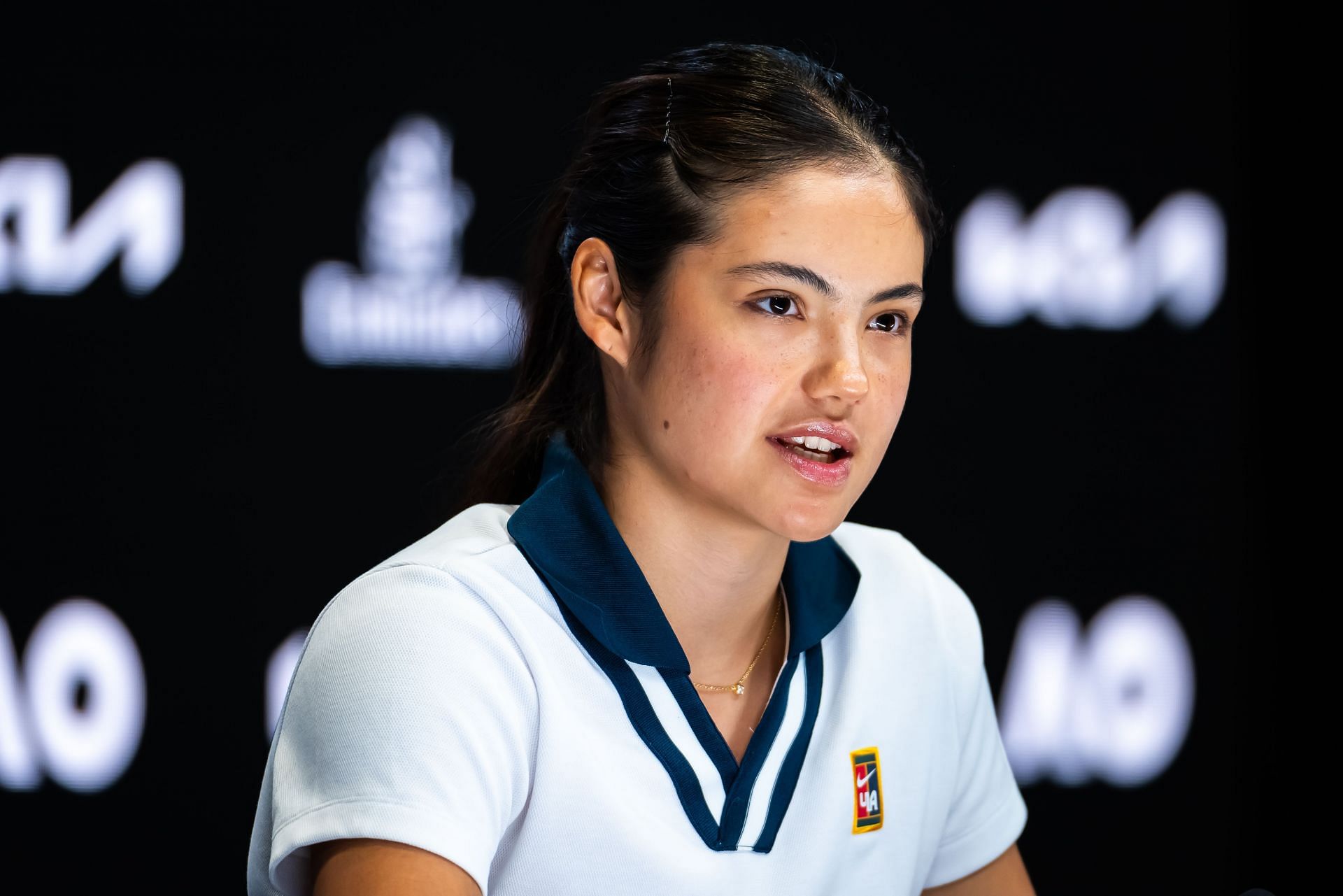 Emma Raducanu pictured speaking at a press conference [Image Source: Getty Images]