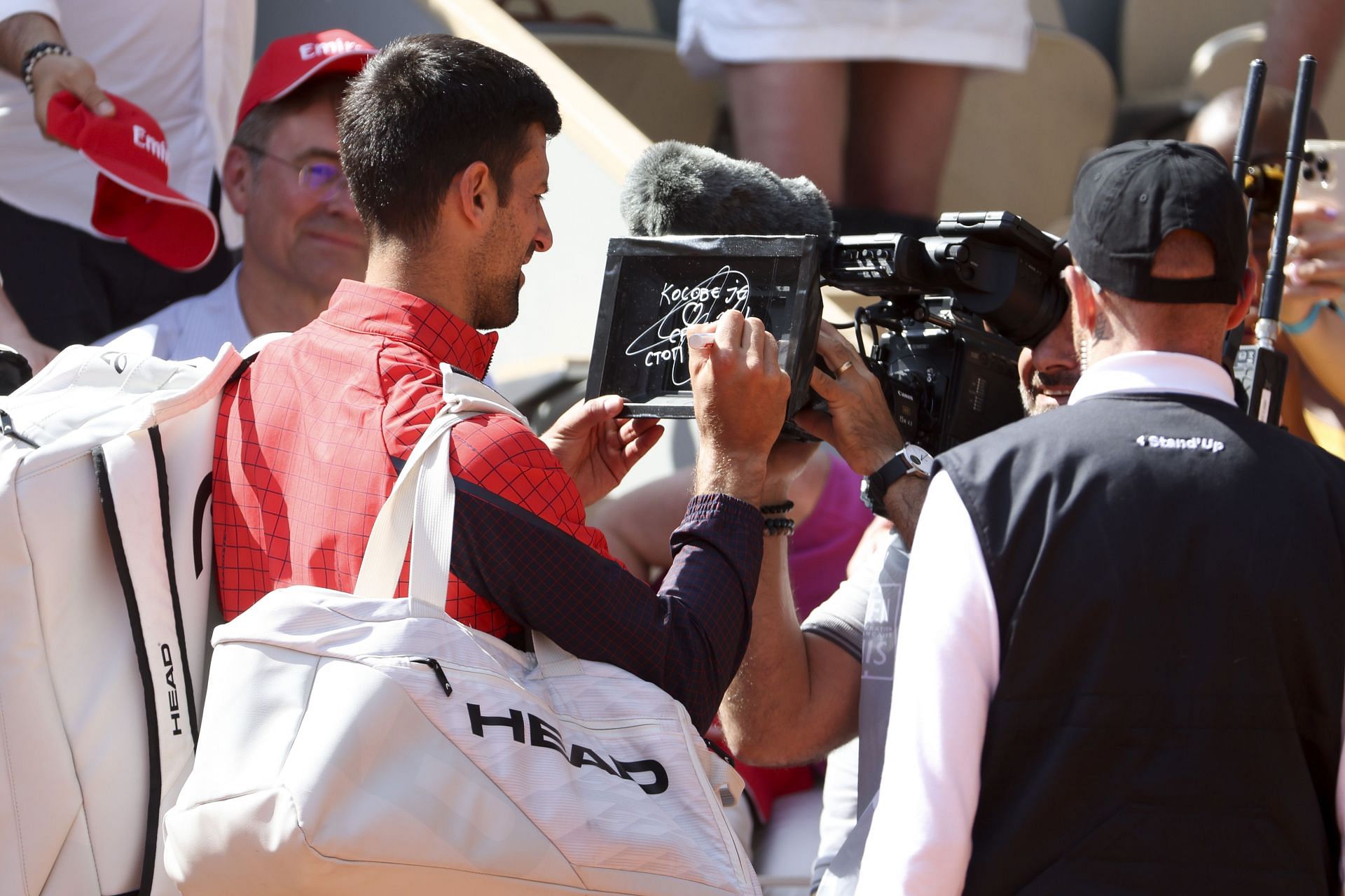 Novak Djokovic sign the camera at the 2023 French Open | Image Source: Getty