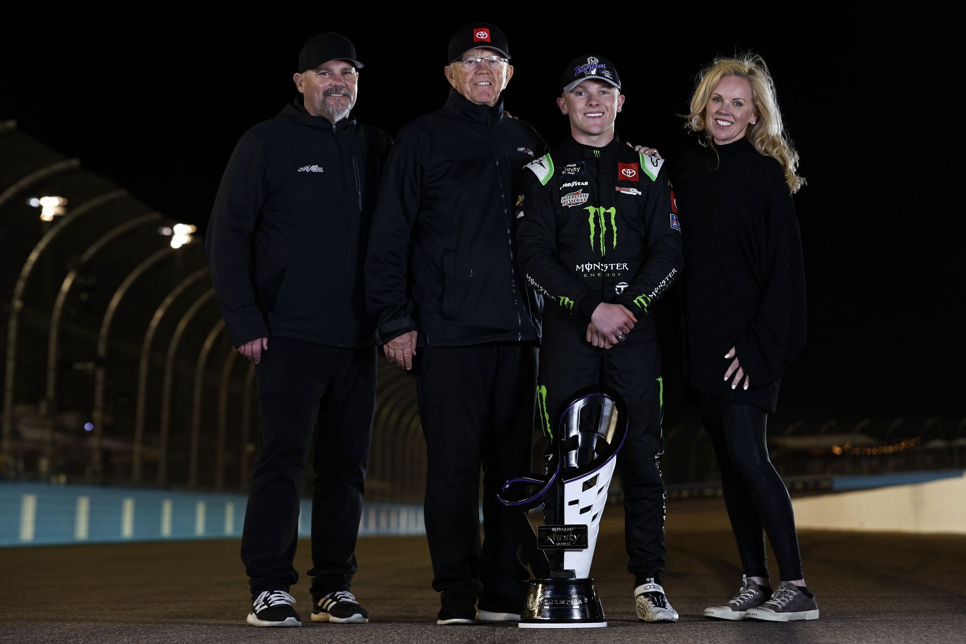 Ty Gibbs, driver of the #54 Monster Energy Toyota, poses with his grandfather, JGR team owner and Hall of Famer Joe Gibbs, his father, Coy Gibbs and mother, Heather Gibbs - Source: Getty