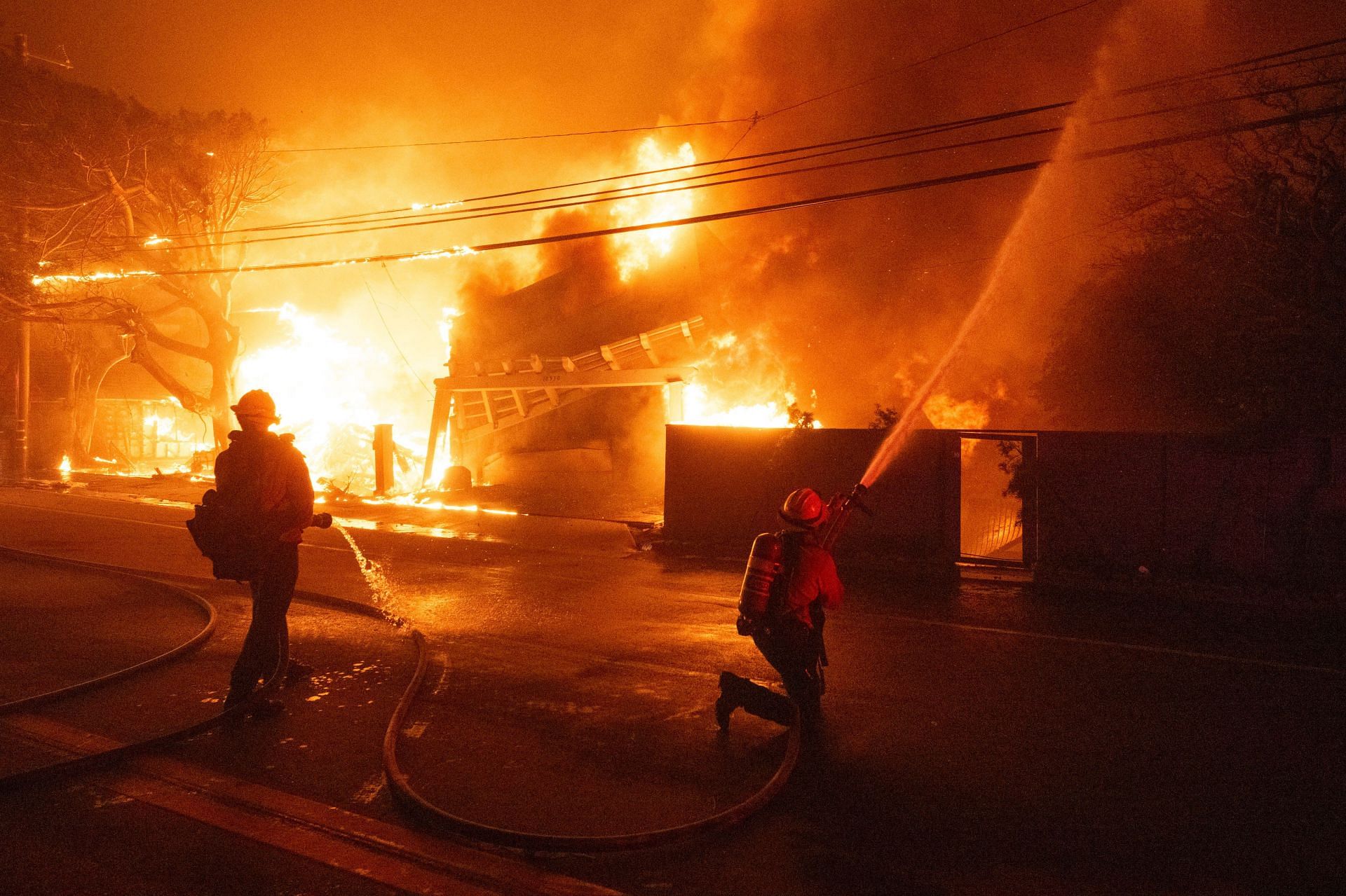 Firefighters battle powerful winds as it fuel multiple fires across Los Angeles Area (Image via Getty)