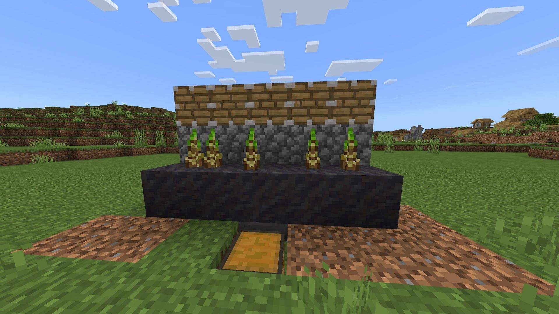 Place mud on top of hoppers, with bamboo on them and pistons on top (Image via Mojang Studios)