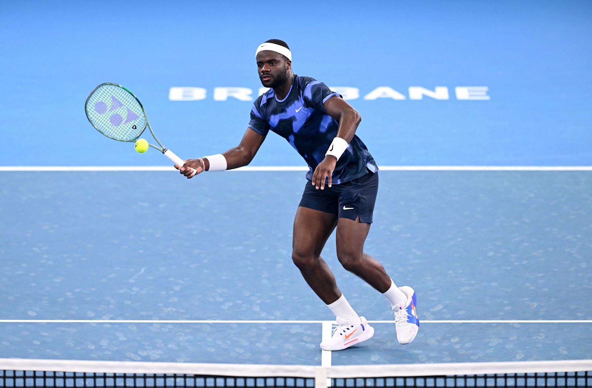 Frances Tiafoe hits a volley at Brisbane (Credits: Getty)