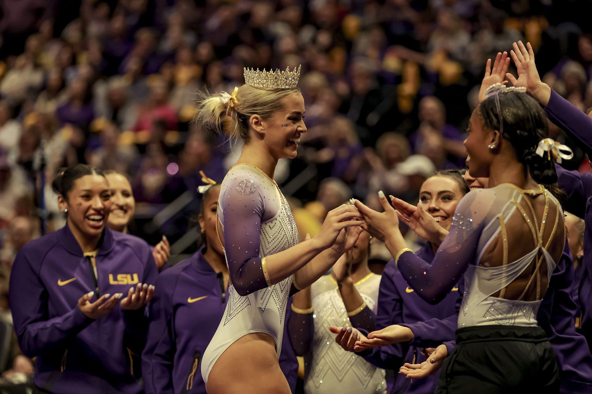 Olivia Dunne of the LSU Tigers celebrates with teammates during a meet against Iowa State at the Pete Maravich Assembly Center in Baton Rouge, Louisiana. (Photo by Getty Images)