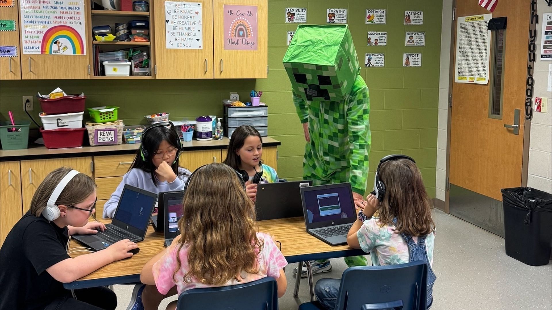 Shad engaging students in Minecraft Hour of Code decked as the creeper mob (Image via Shad Lacefield)