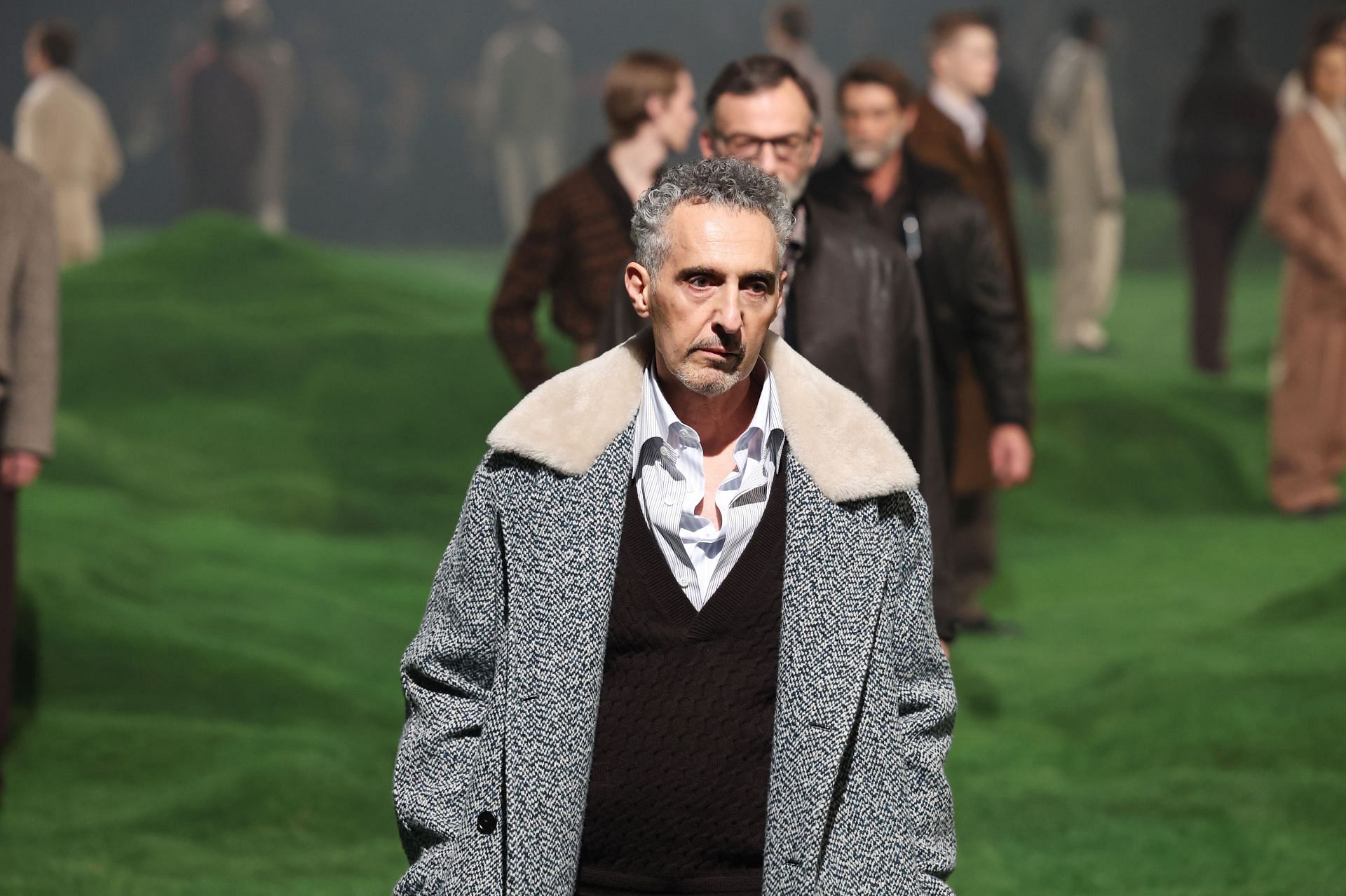 John Turturro seen walking the ramp at the Milan Fashion Week in January 2025 (Image via Getty)