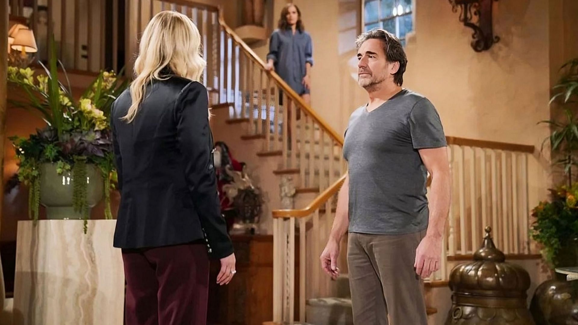 Taylor Hayes in the background as Ridge Forrester speaks to Brooke Logan in a still from The Bold and the Beautiful (Image via CBS)