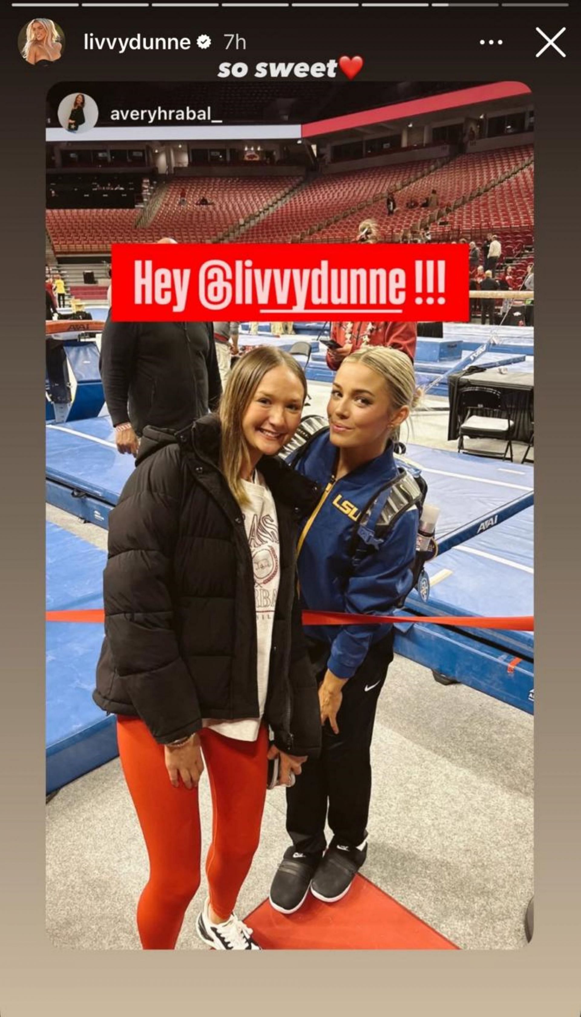 Olivia Dunne shares a moment with a fan at LSU meet; Instagram - @livvydunne