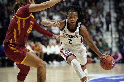 KK Arnold (#2) of the UConn Huskies drives to the basket against Sydney Harris (#25) of the Iowa State Cyclones during the second half of their NCAA game at Mohegan Sun Arena. Photo: Getty