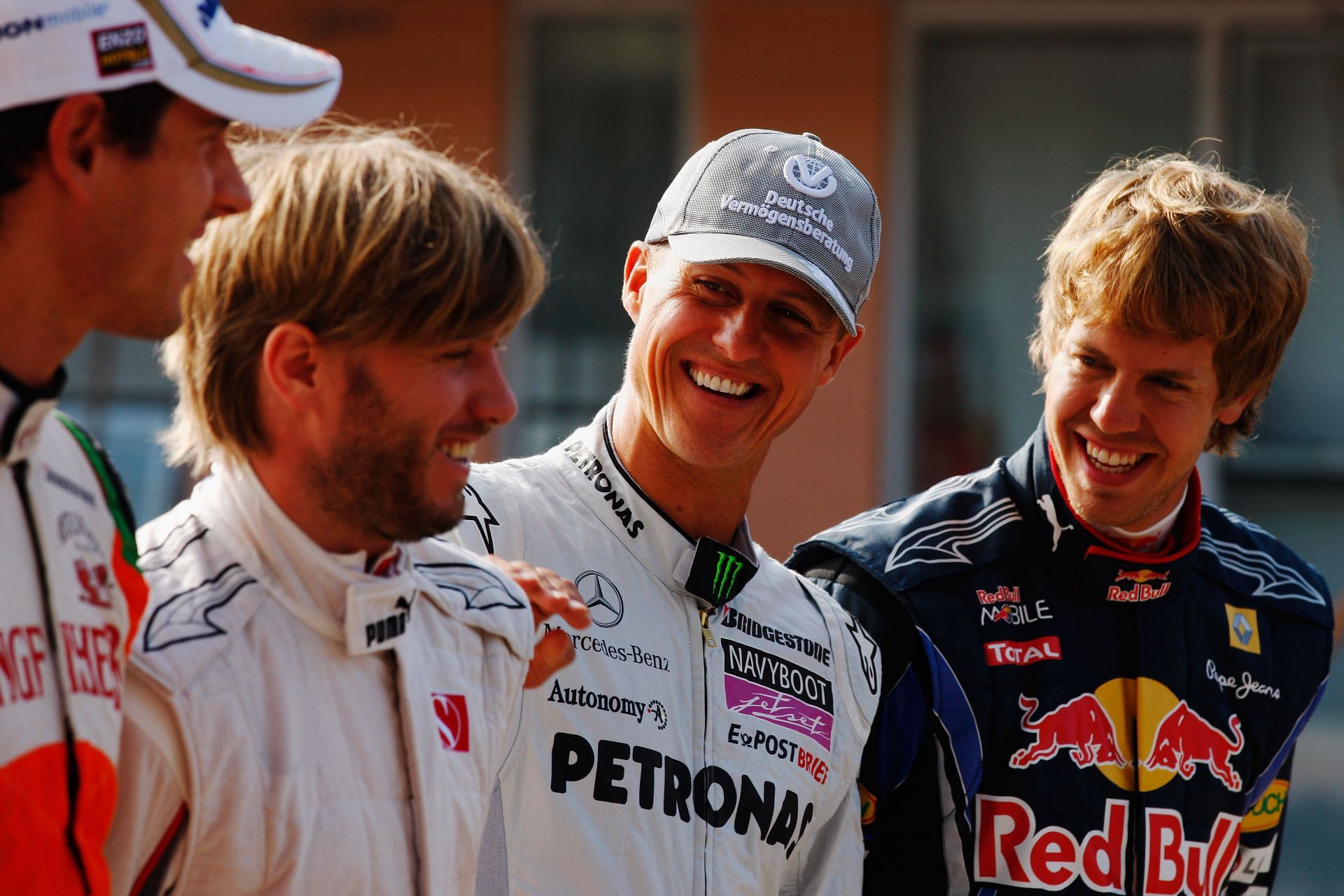 (L-R) Drivers Nick Heidfeld, Michael Schumacher, and Sebastian Vettel share a joke as they line up for a photograph before practice for the Korean Formula One Grand Prix - Source: Getty