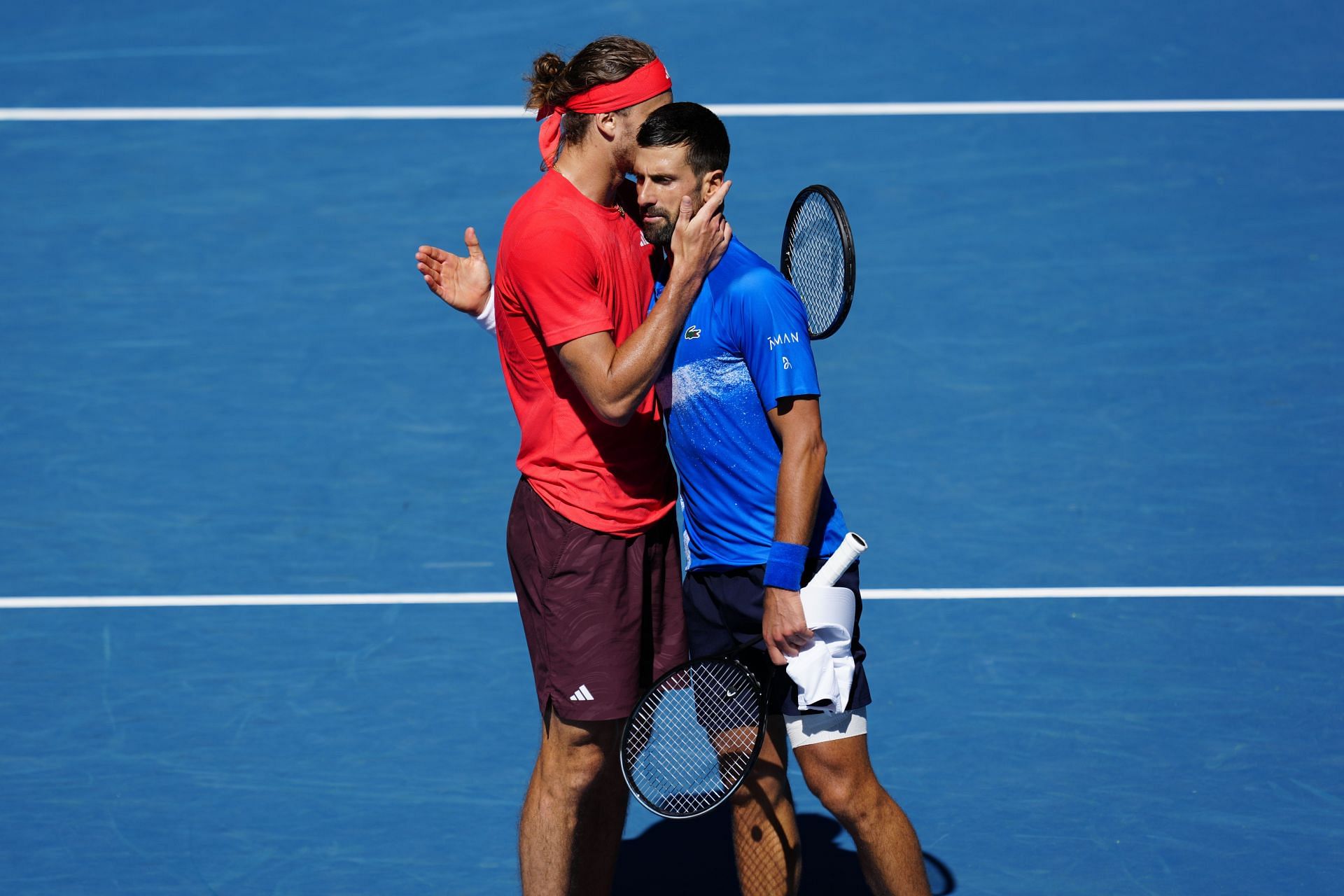 Alexander Zverev (L) shakes hands with Novak Djokovic at the 2025 Australian Open (Source: Getty)