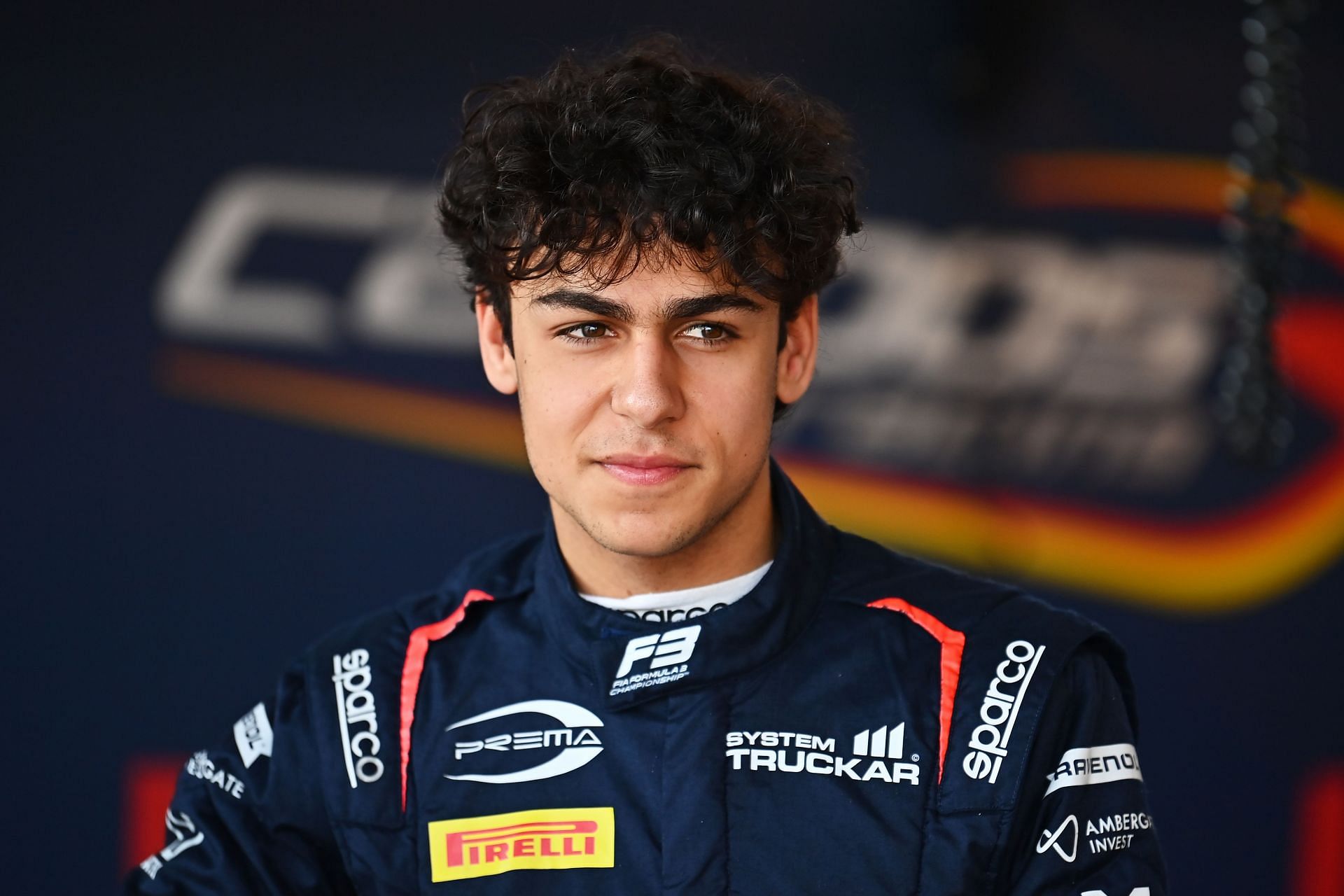 Arvid Lindblad of Great Britain and Campos Racing (20) looks on in the garage - Source: Getty