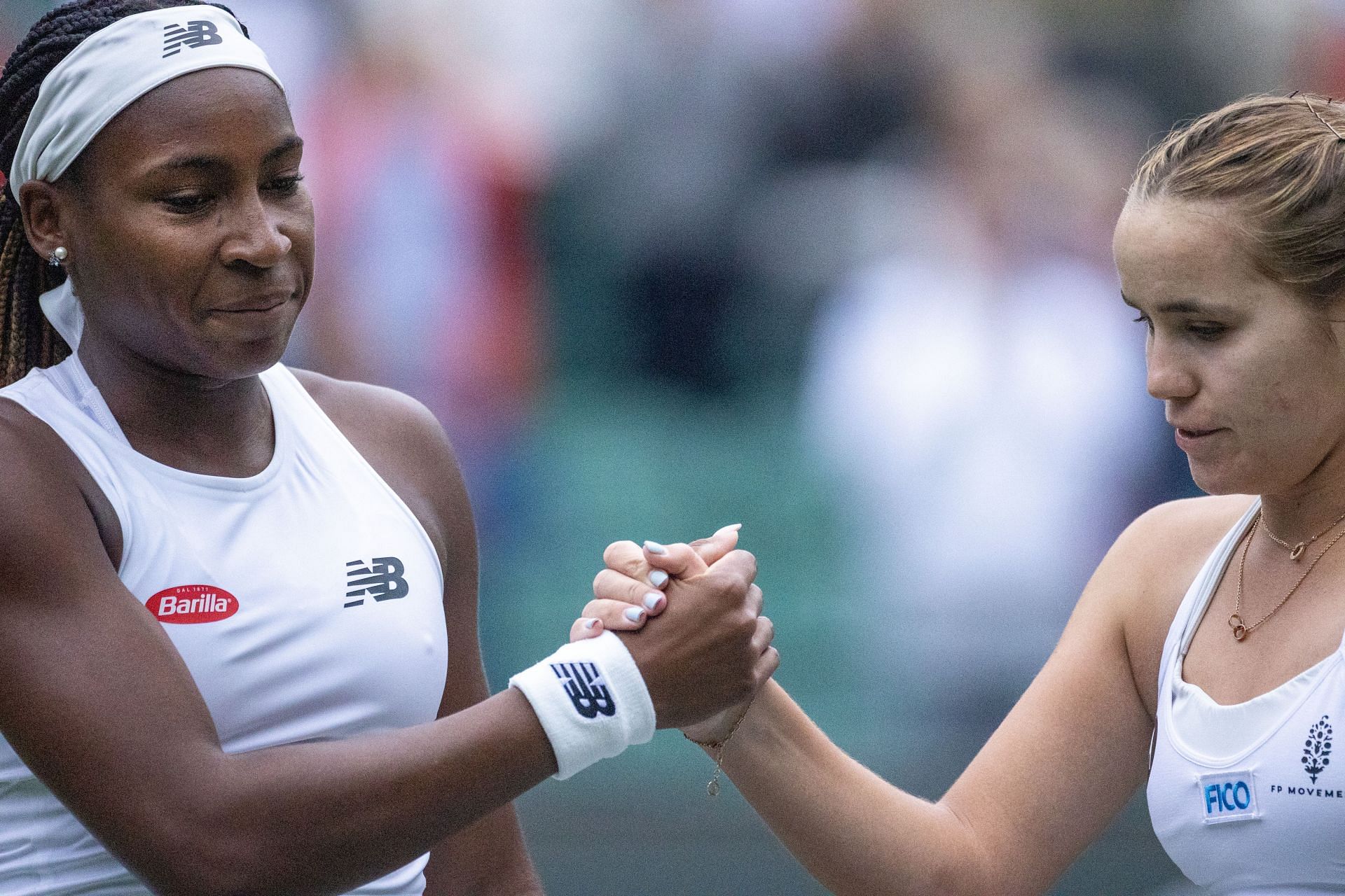 Coco Gauff (L) and Sofia Kenin greet each other after their Wimbledon clash | Getty Images