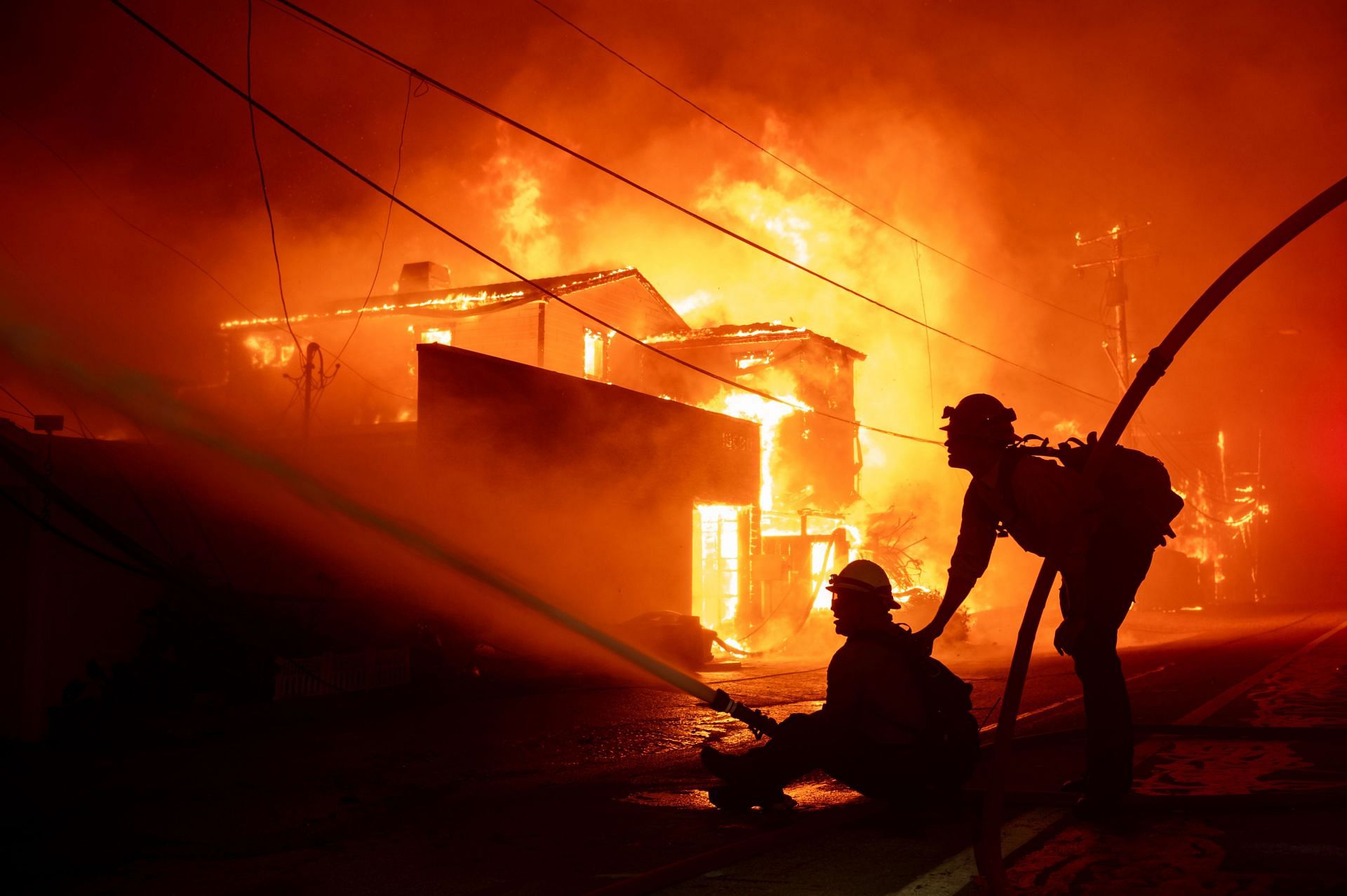 Firefighters battle powerful winds as it fuel multiple fires across Los Angeles Area (Image via Getty)