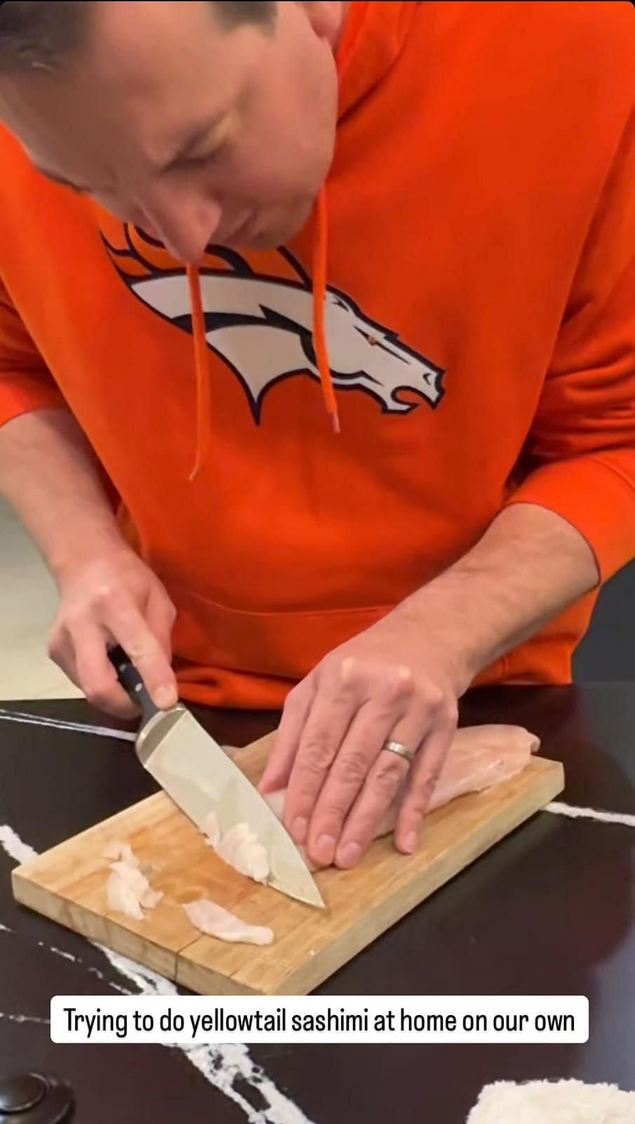 Kyle Busch carefully cutting the fish into thin slices (Source: @samanthabusch via Instagram)