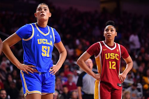 UCLA Bruins center Lauren Betts (#51) looks on with USC Trojans guard JuJu Watkins (#12) during their NCAA basketball game on January 14, 2024 at Galen Center in Los Angeles, CA. Photo: Getty