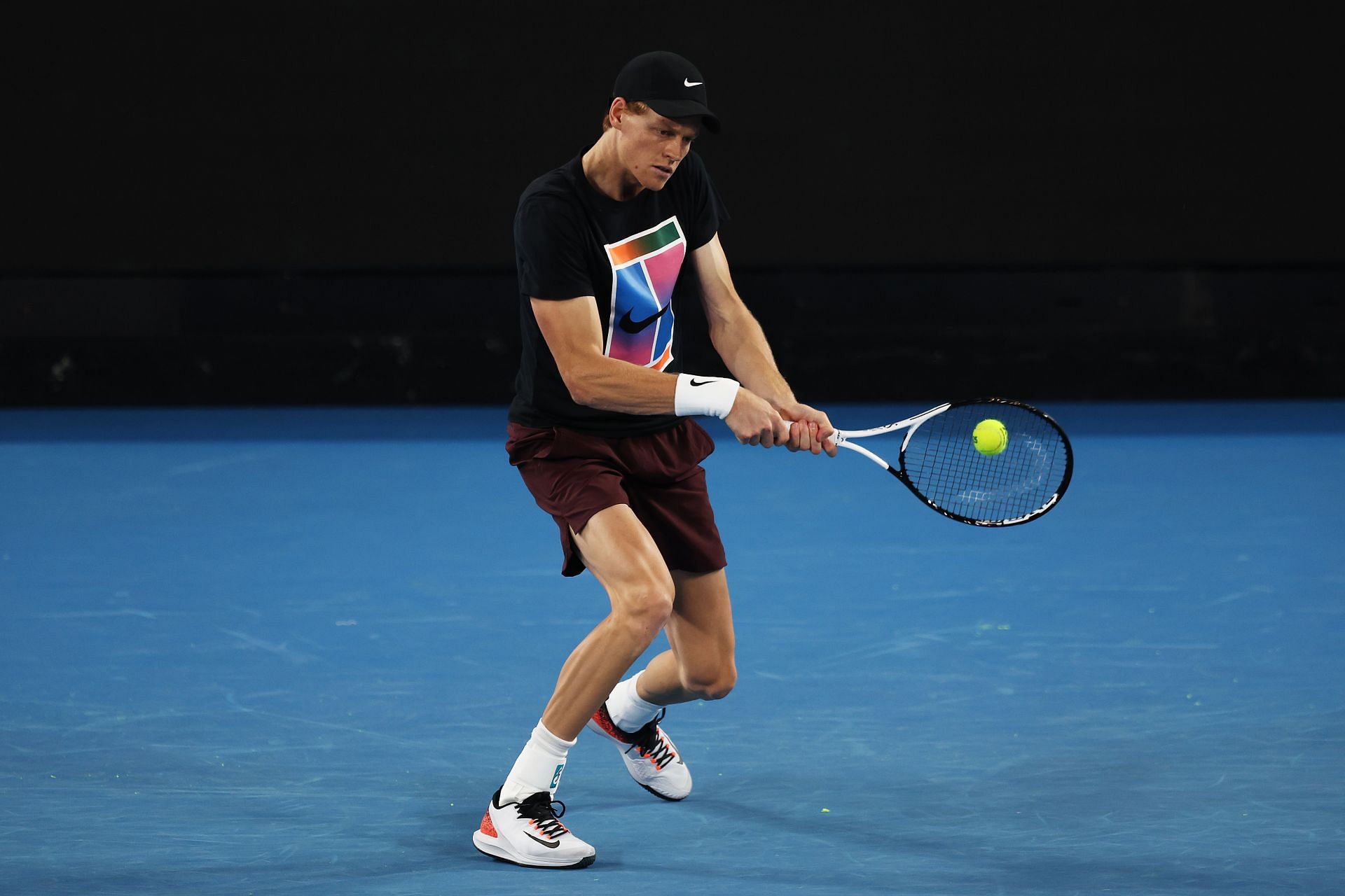 Jannik Sinner plays a backhand during a practice session ahead of the 2025 Australian Open - Source: Getty