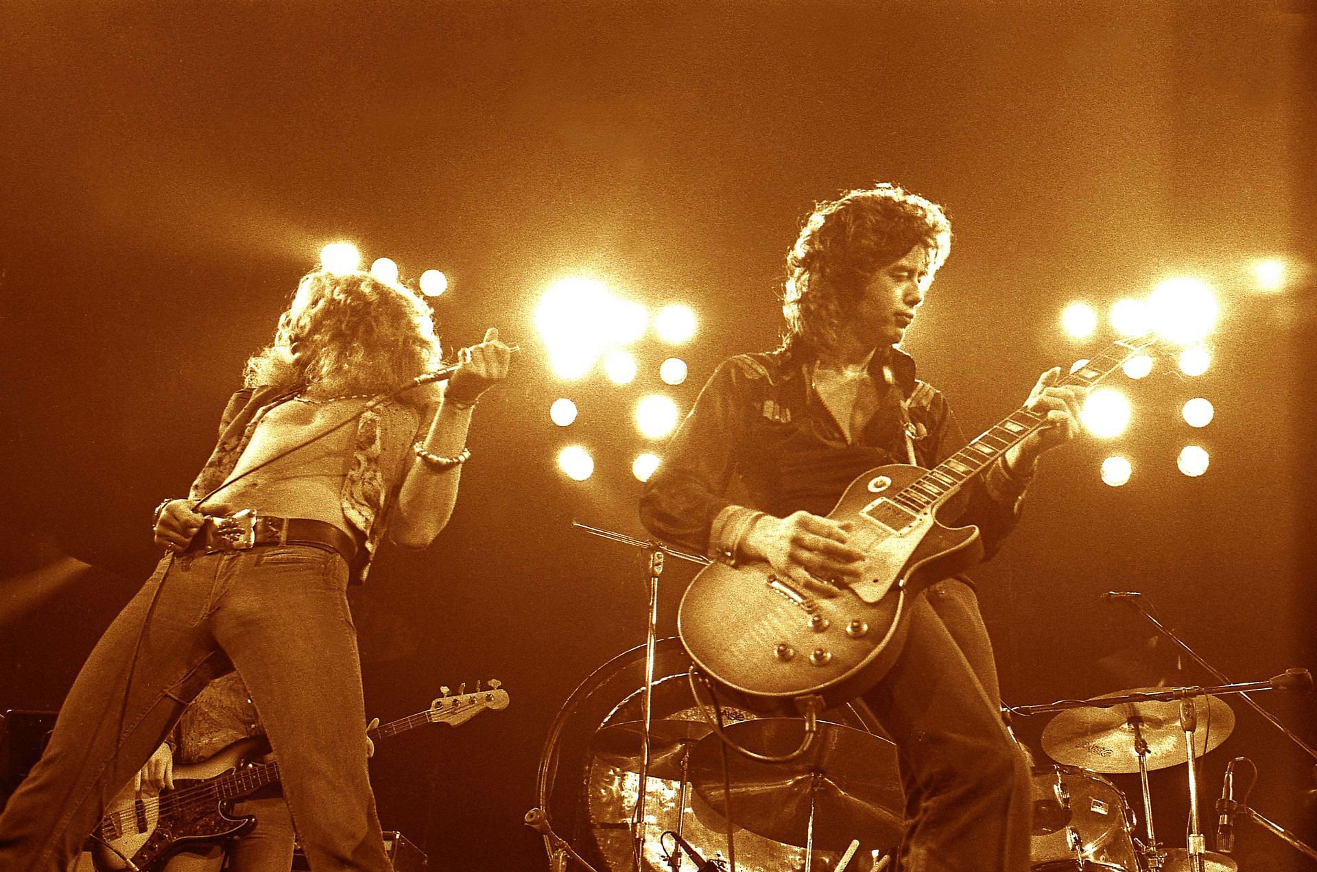 Jimmy Page and Robert Plant performing live (Image via Getty)