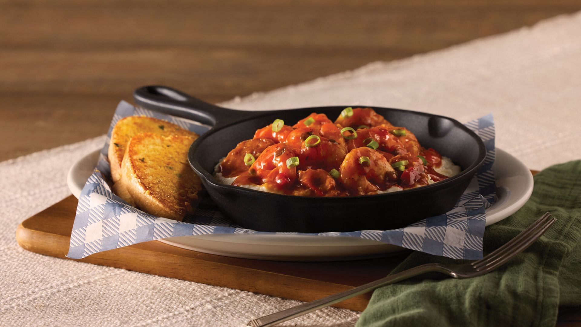 Shrimp n&#039; Grits has shrimp and andouille sausage with grilled parmesan bread (Image via Cracker Barrel)