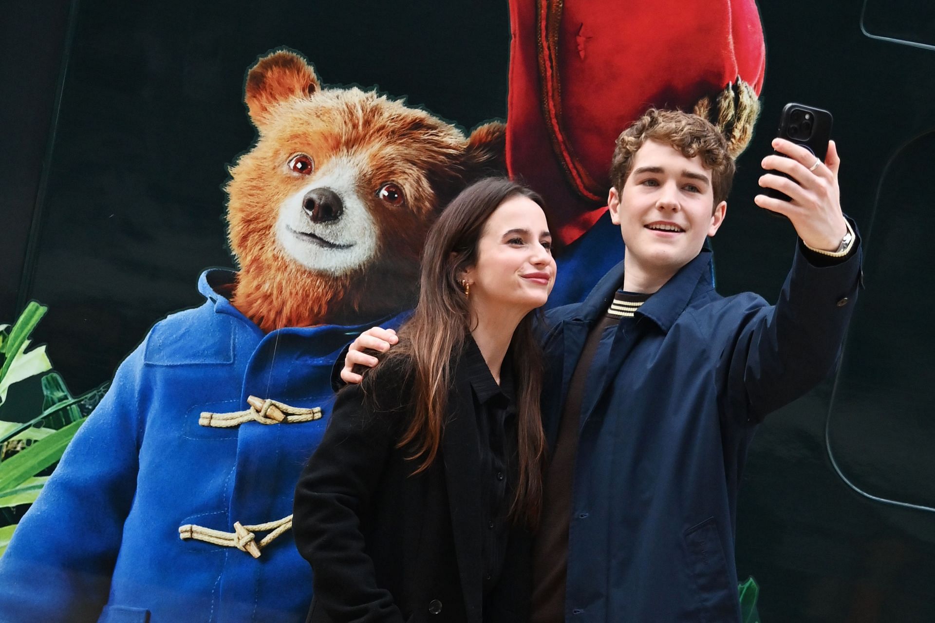 Samuel Joslin with Madeleine Harris in &quot;Paddington In Peru&quot; Great Western Railway Train Unveil Photocall (Image via Getty)