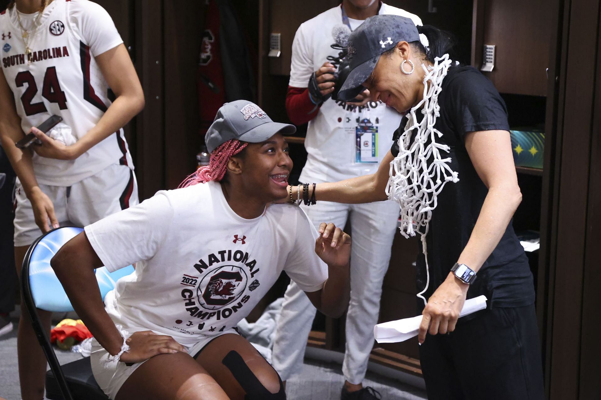  Aliyah Boston #4 of the South Carolina Gamecocks and head coach Dawn Staley of the South Carolina Gamecocks celebrate in the locker room after defeating the UConn Huskies during the championship game of the NCAA Women&rsquo;s Basketball Tournament at Target Center on April 3, 2022 - Source: Getty