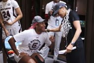 Aliyah Boston #4 of the South Carolina Gamecocks and head coach Dawn Staley of the South Carolina Gamecocks celebrate in the locker room after defeating the UConn Huskies during the championship game of the NCAA Women’s Basketball Tournament at Target Center on April 3, 2022 - Source: Getty