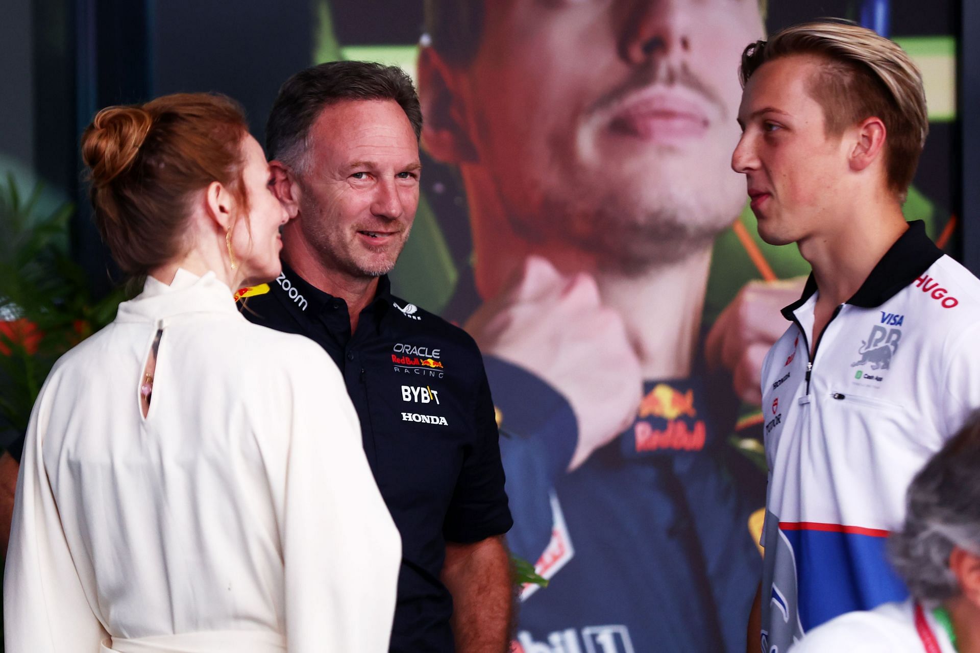 Christian Horner talks with Geri Horner (L) and Liam Lawson (R) in the Paddock before the F1 Grand Prix of Saudi Arabia - Source: Getty